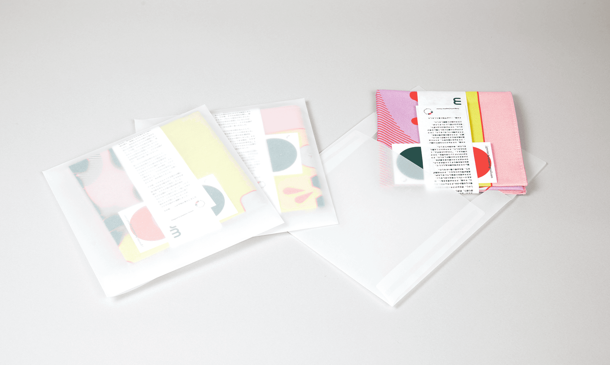 Furoshiki packaging set including the folded Wrap a Tale cloth and printed story booklet designed by Josephine Grenier.