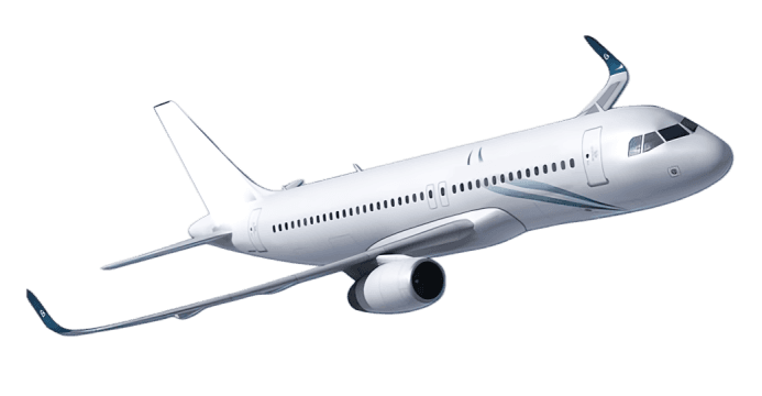 Airplane flying over mountains at sunset