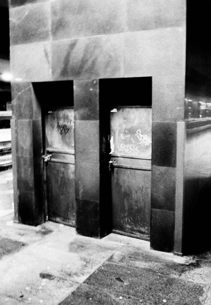 Palina – Soft Laziness – seated cross-legged on floor cushions with her head tilted back peacefully