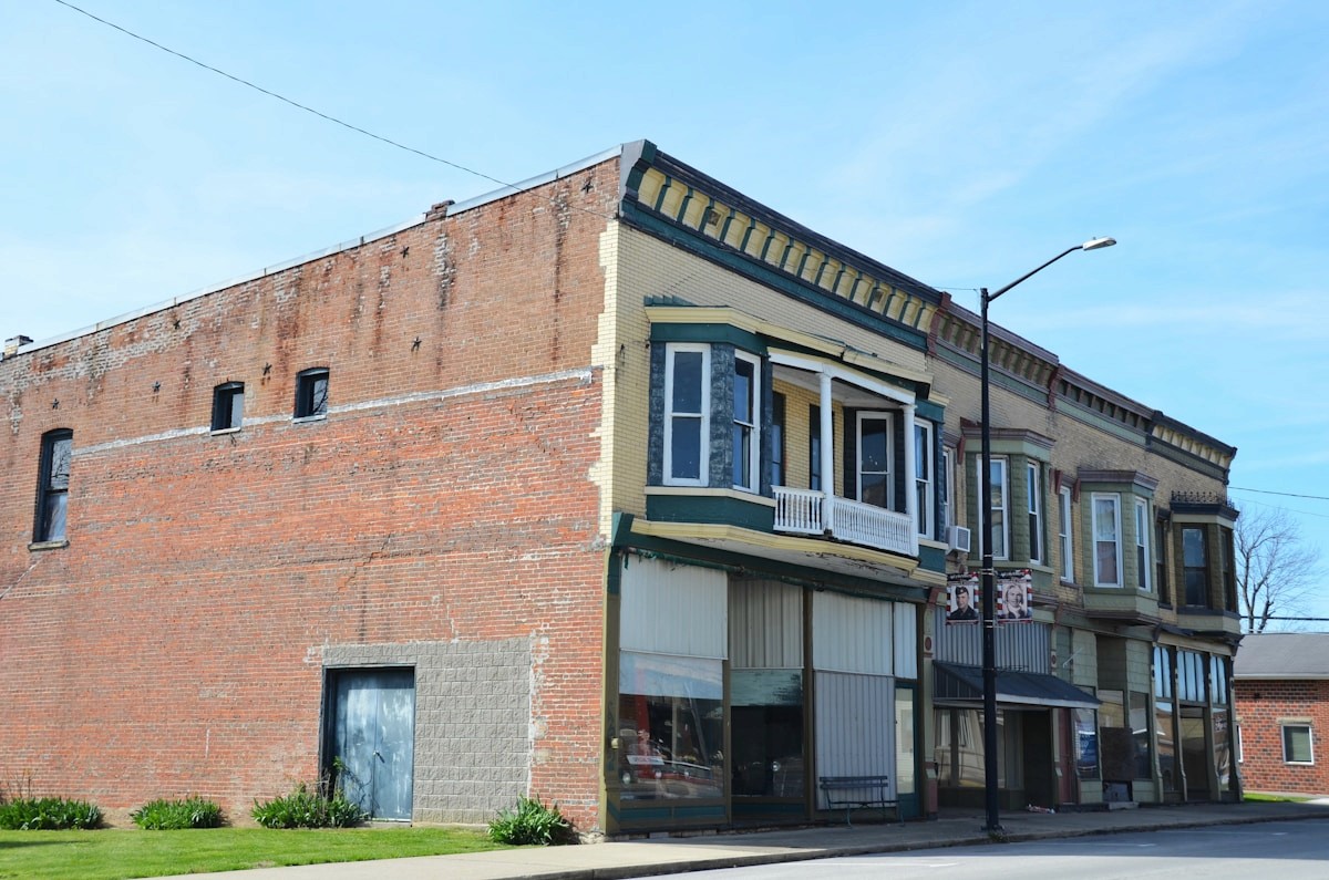 Brick storefront buildings along a downtown street