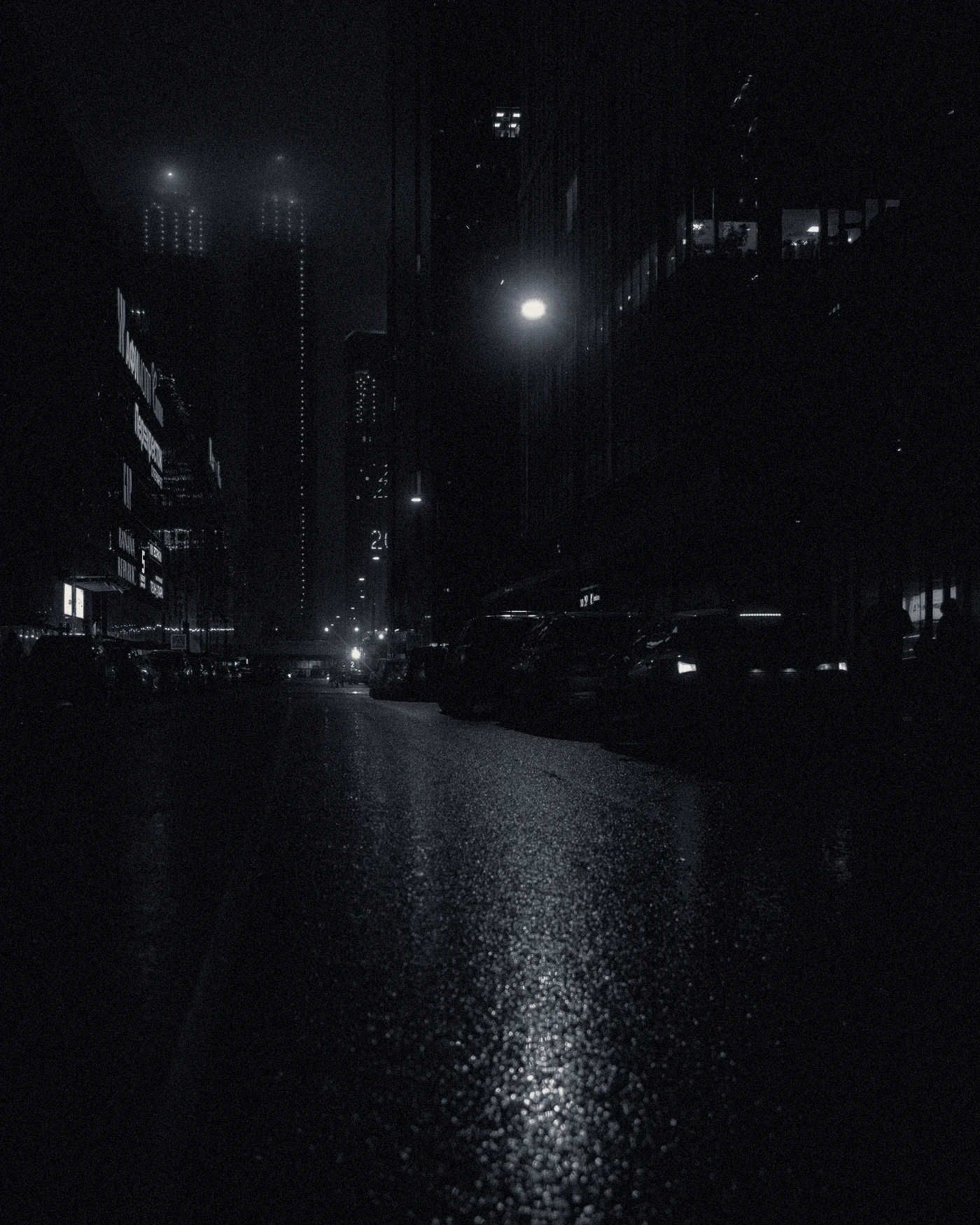 A wet city street at night