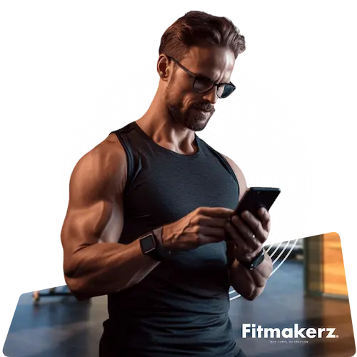 Fitmakerz - Un coach sportif  regarde son ebook fitness sur son smartphone