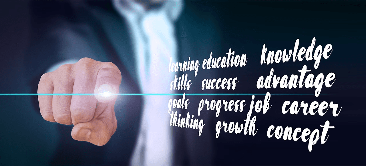 Person pointing at motivational business keywords and success concepts