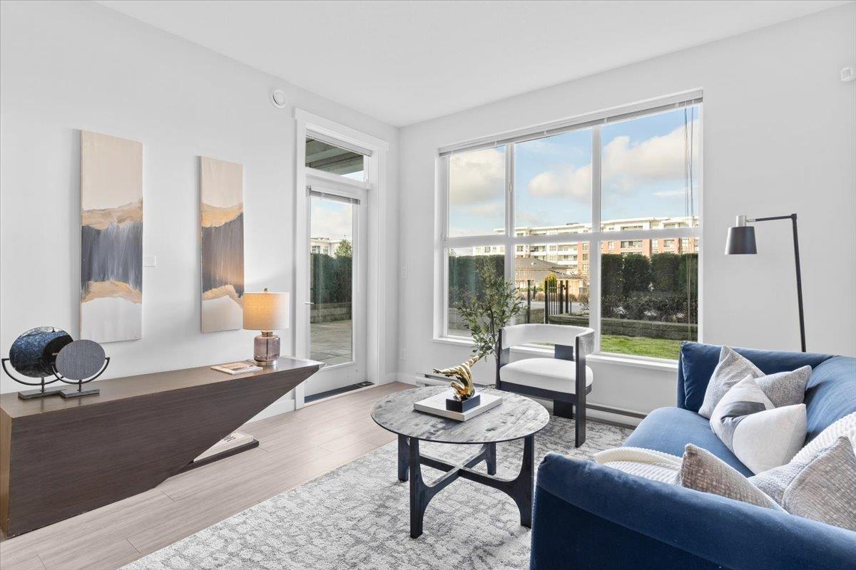 Bright, modern living room featuring large windows, stylish furniture, and a serene atmosphere.