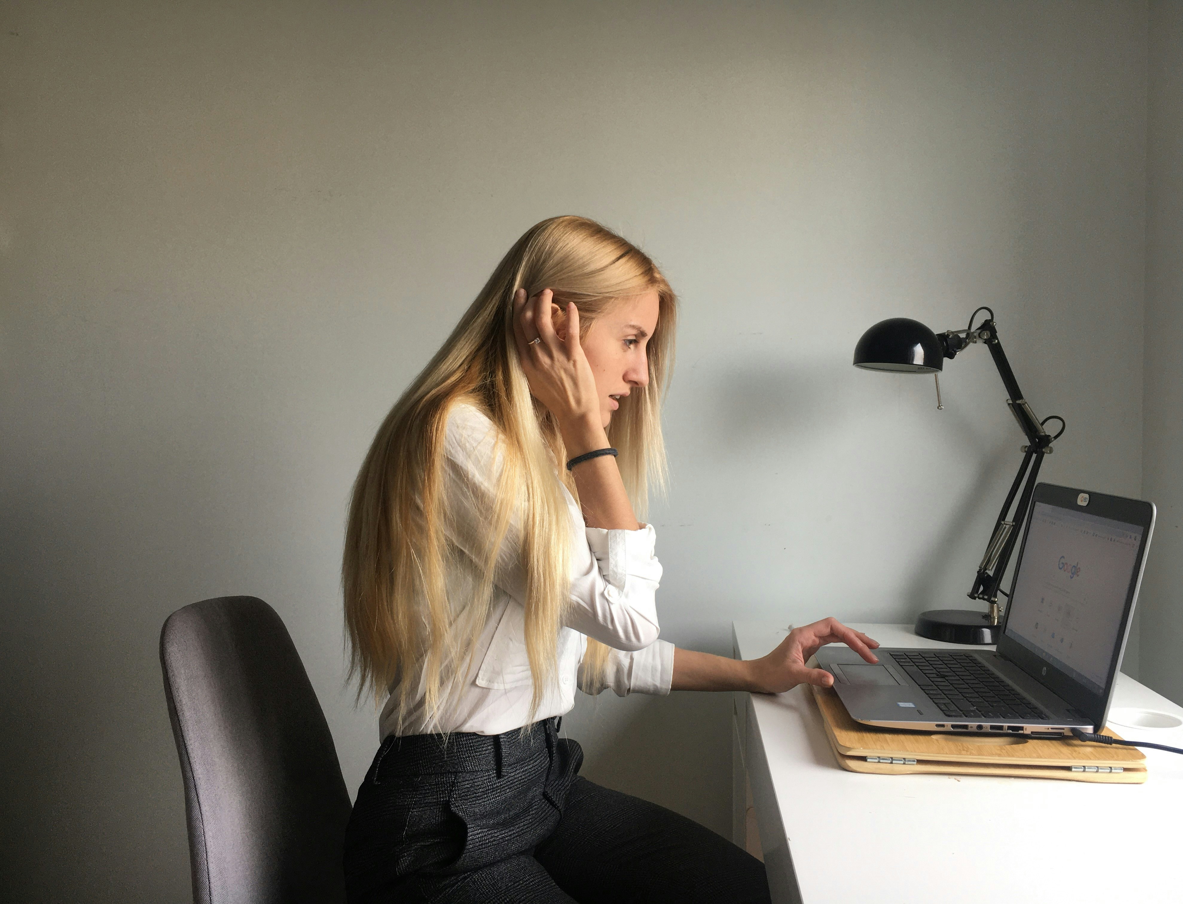 woman on work laptop - gmail filter multiple senders