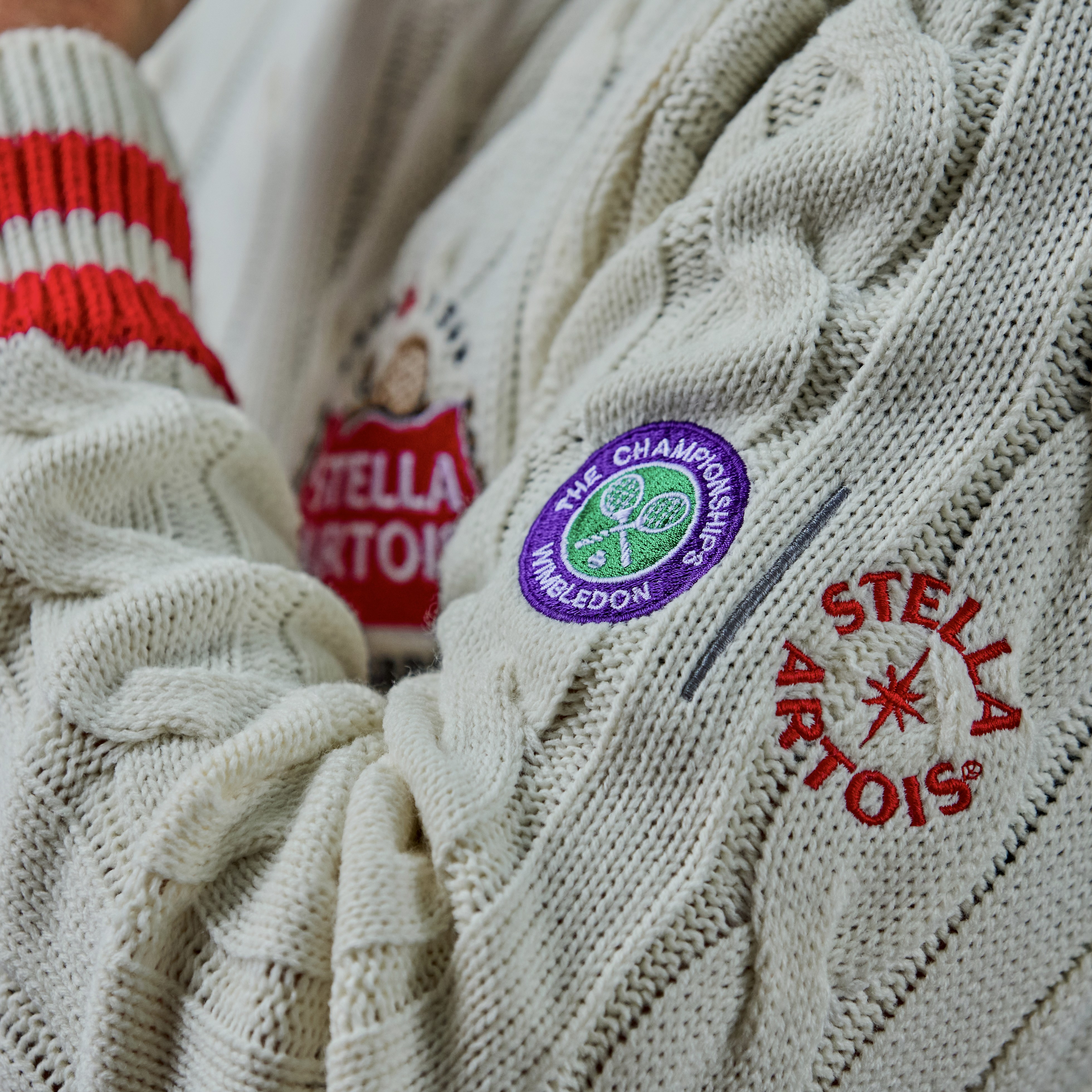 a woman sitting on a chair with a hair dryer