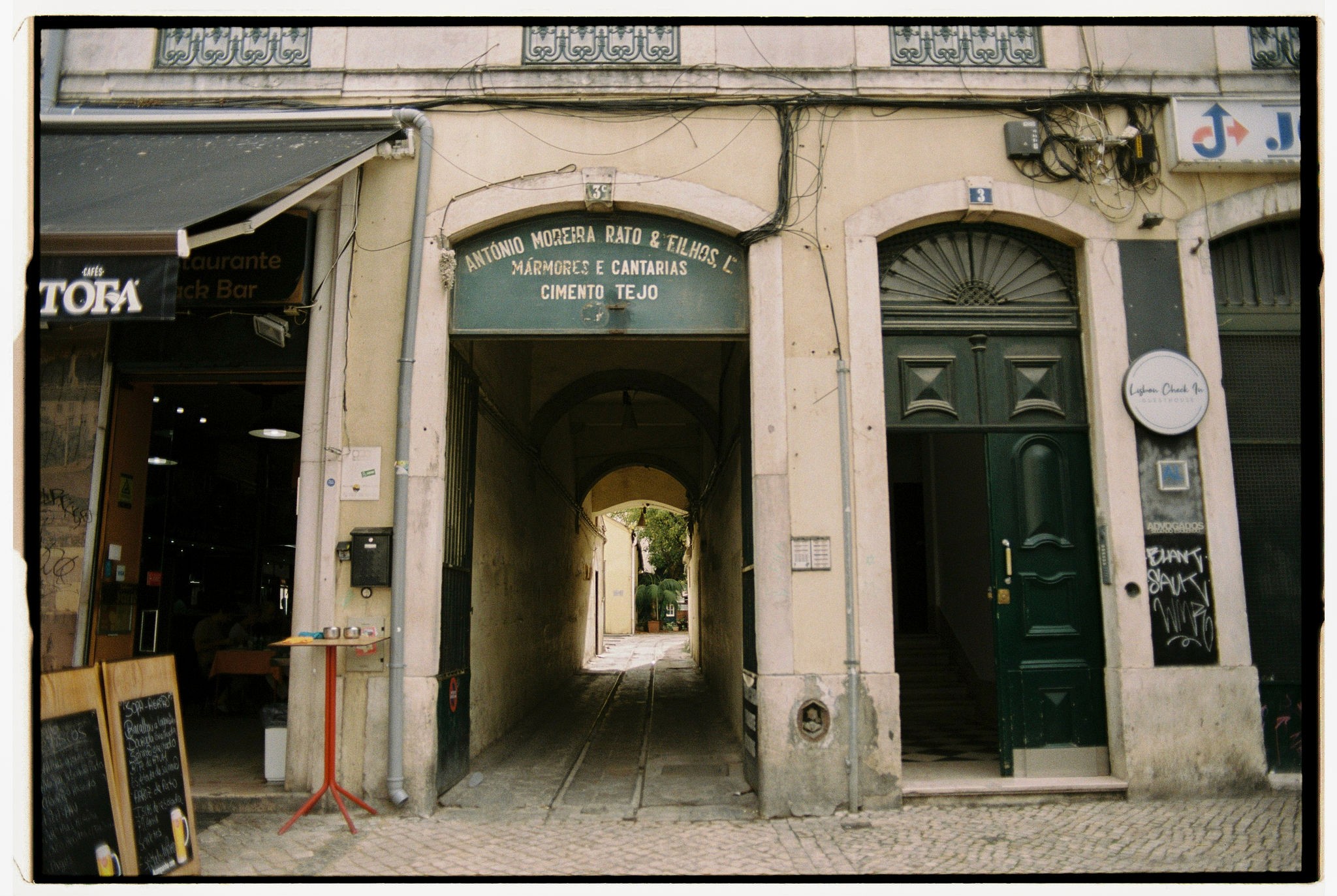 Modern skyscrapers line a busy highway in a sprawling city.