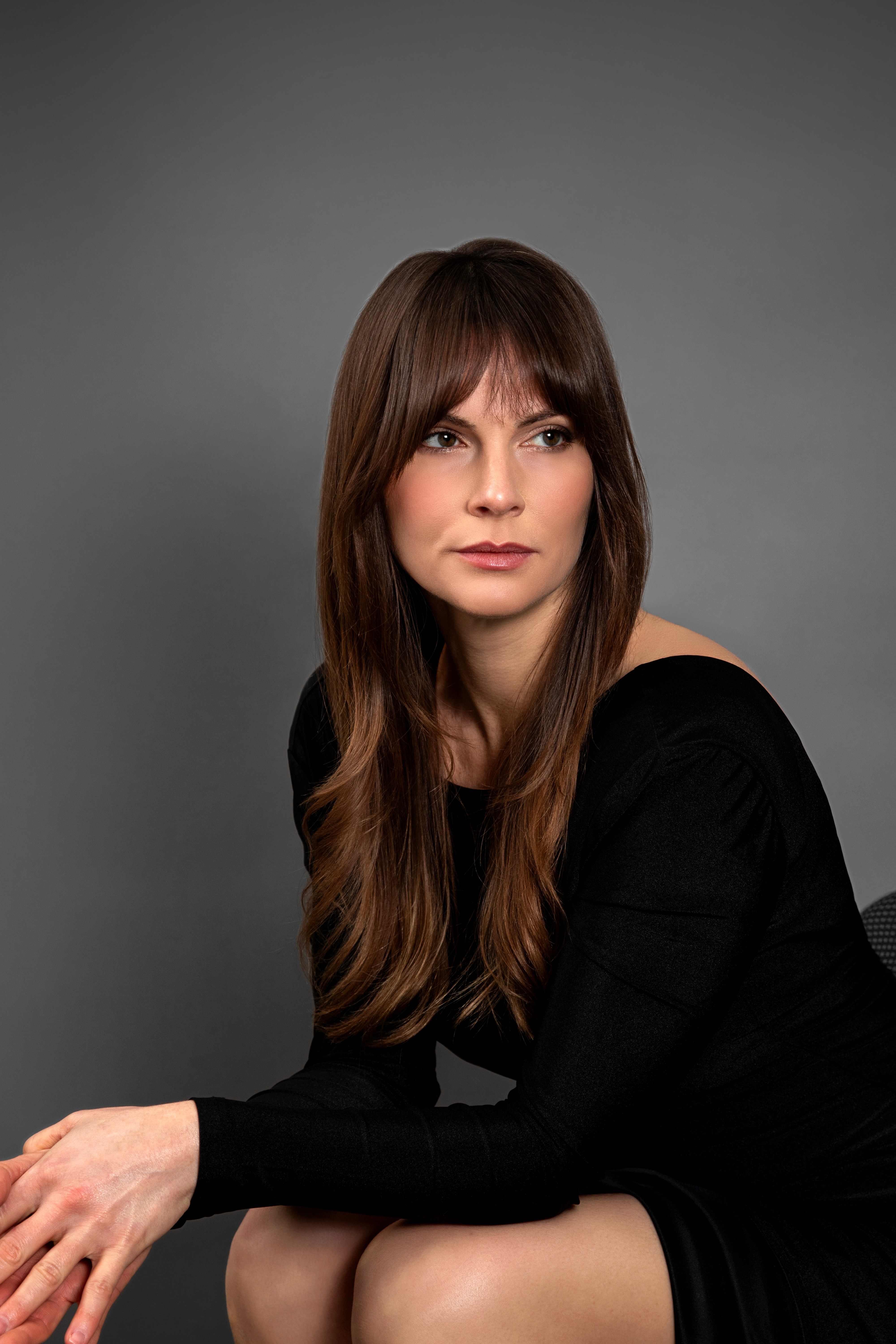 Kara Redman in chair black and white photo