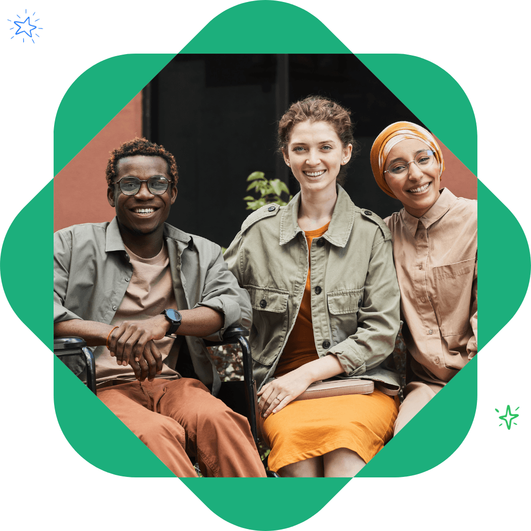 Diverse group of friends smiling and joining hands in a circle, symbolizing teamwork and collaboration.