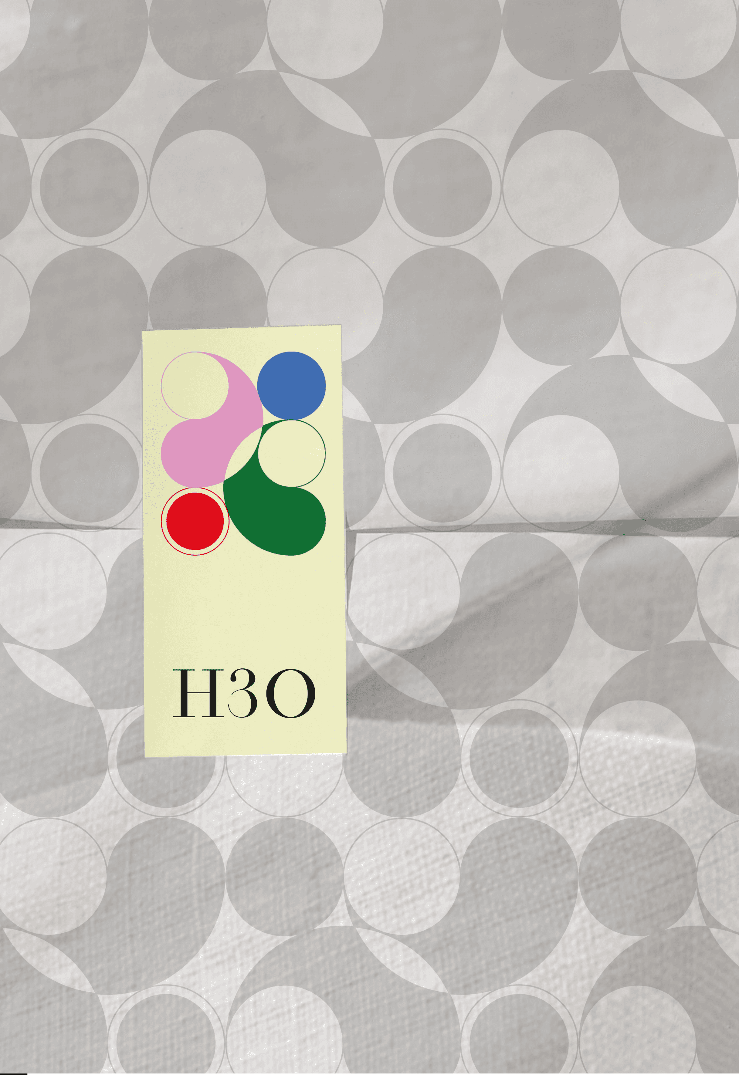 Vertical H3O stickers on a pattern wrapping paper.