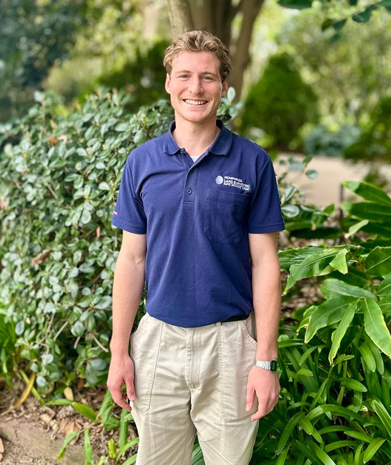 A profile image of James Sala in a professional surveyor uniform in an outdoor setting