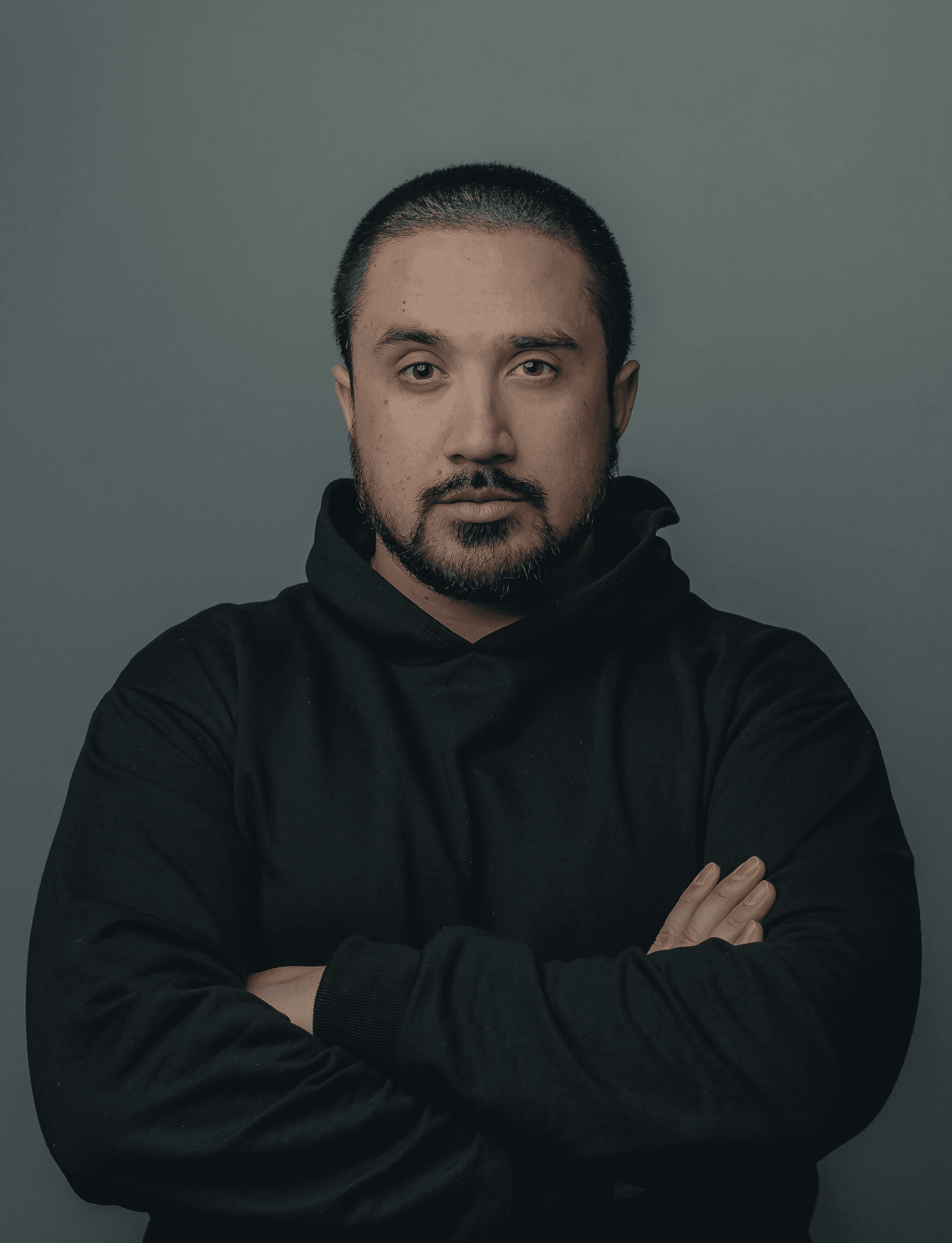 man in black hoodie standing