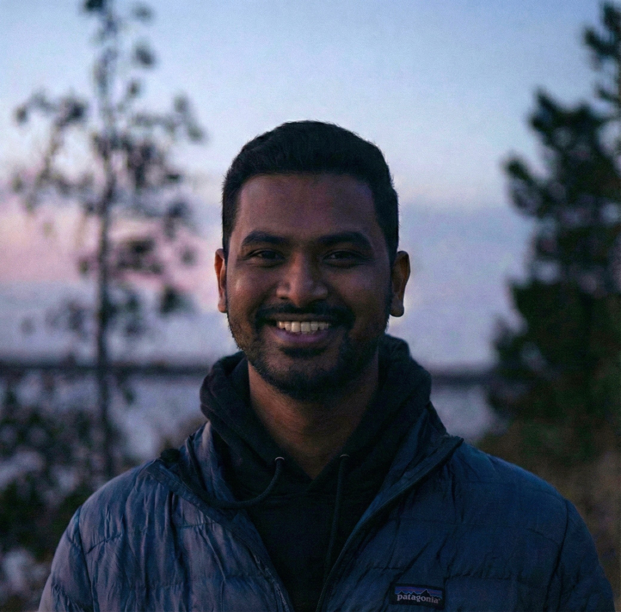 A portrait of a young man smiling