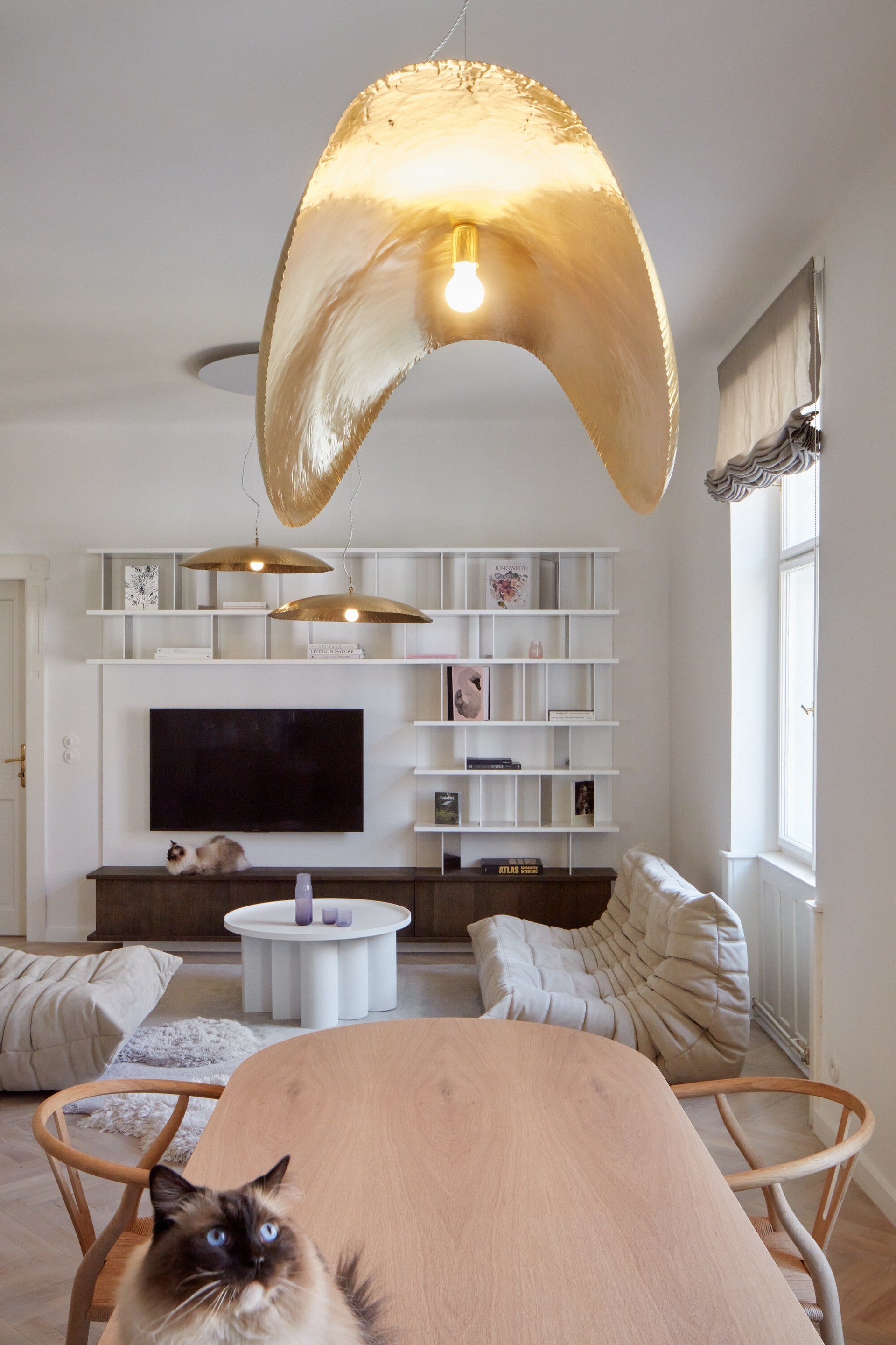 Stella table used in space emphasizing balanced proportions and minimal structure by Jiri Krejcirik