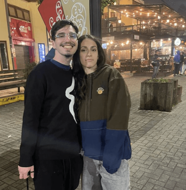 a man wearing glasses and a black shirt