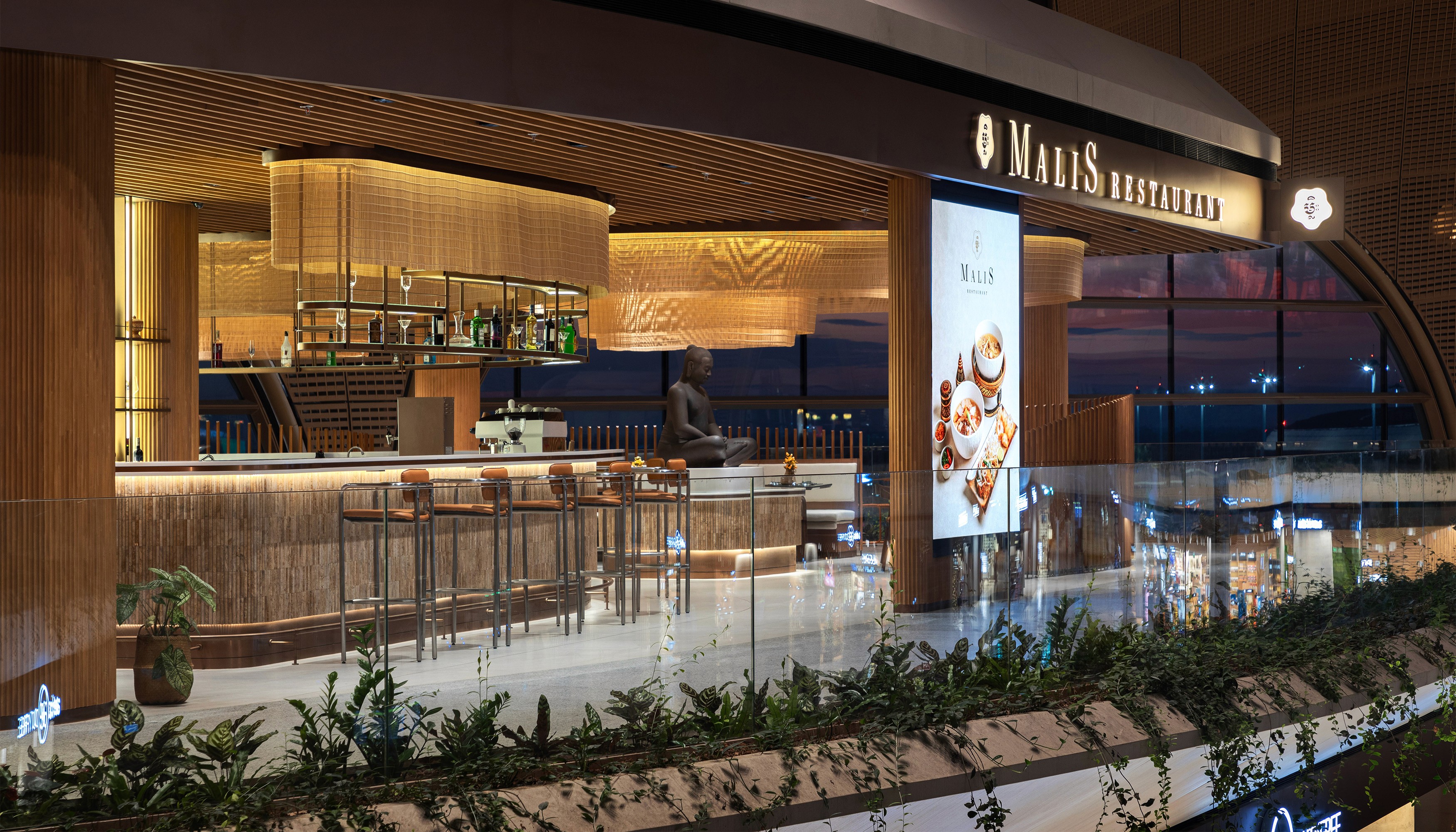 The bar and lounge area at golden hour showcasing the integration of architectural lighting and panoramic views of the airport apron designed to maximize operational atmosphere and guest retention