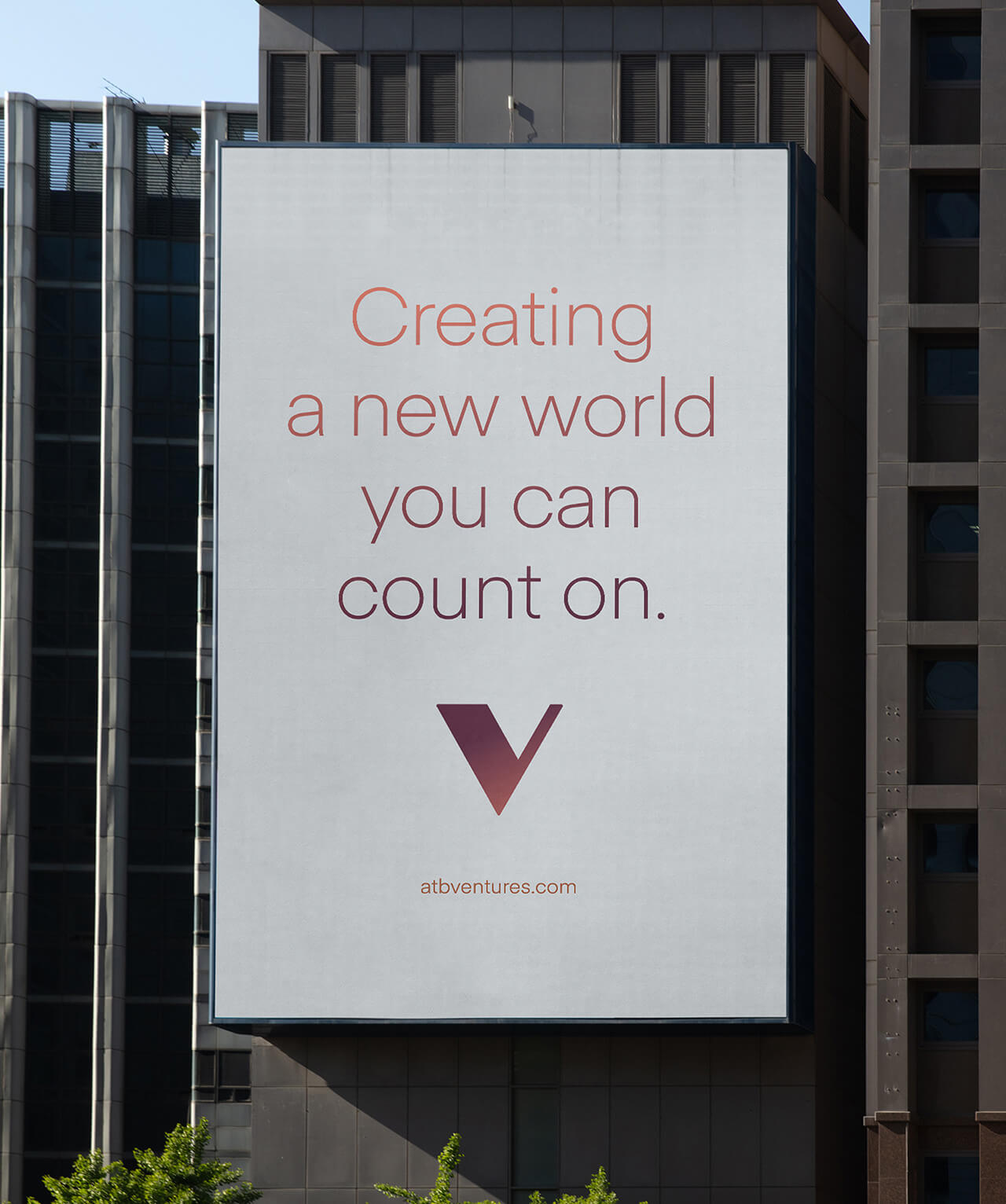 An outdoor billboard that features the ATB Ventures logo and gradient-filled text that reads "Creating a new world you can count on."