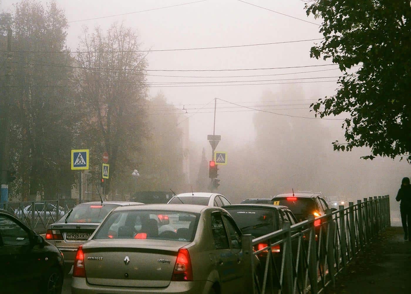Air pollution and mental health: heavily congested road covered in smog