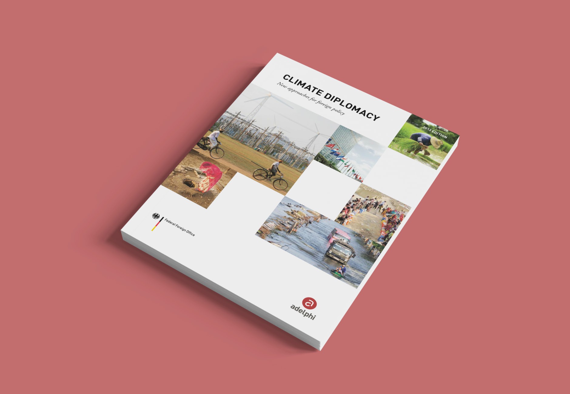 Angled editorial mockup showing the cover design of the Climate Diplomacy policy report on a light red background.