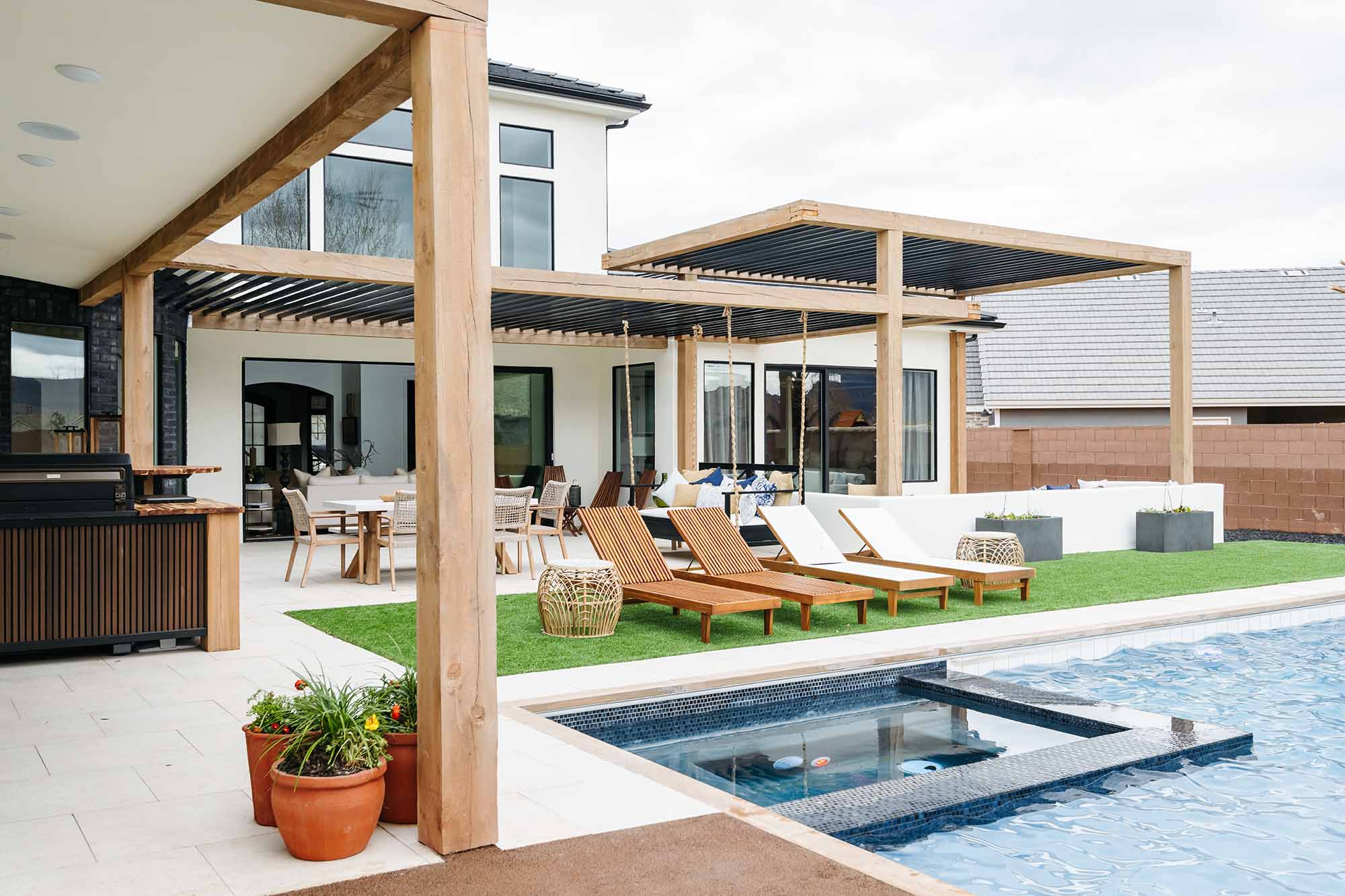 Backyard view looking toward the rear of a custom Hurricane, Utah home by Madsen Homes, showing outdoor living space and landscaping.