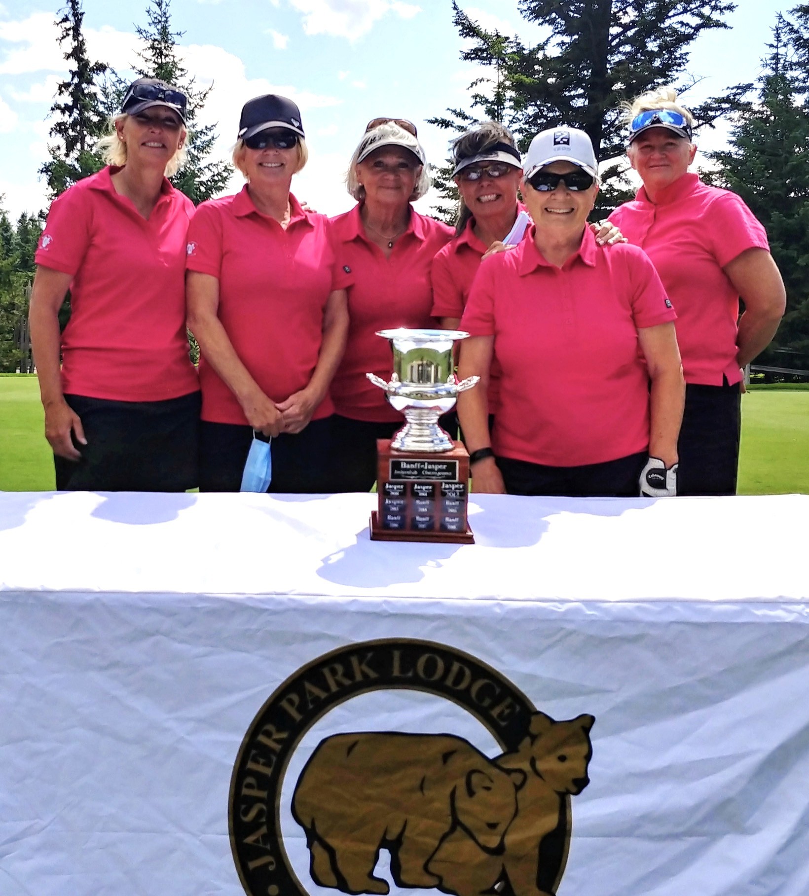 Group of men standing with Sufboard
