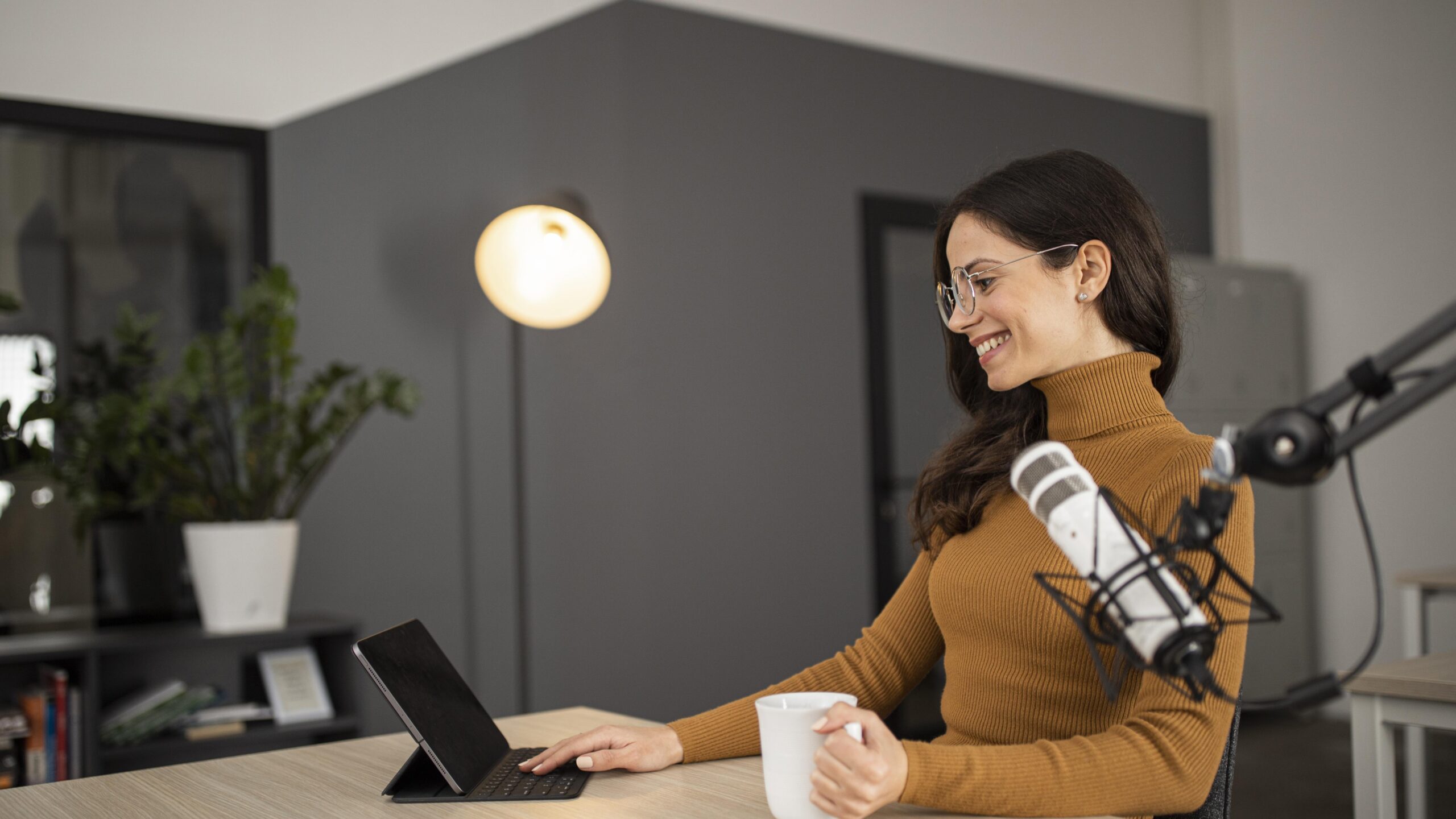 Woman recording a podcast in a studio