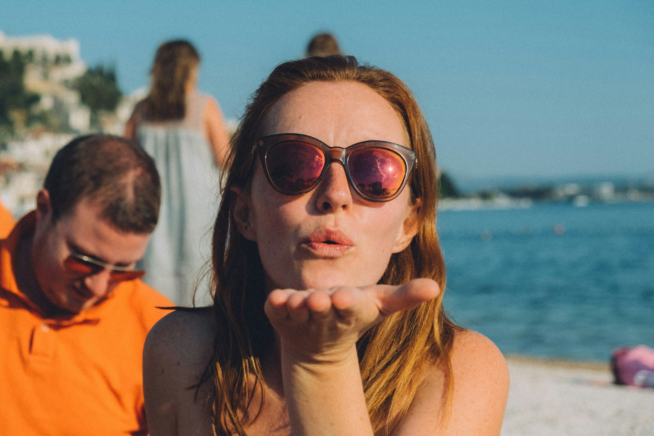 woman giving a flying kiss - What Color Lipstick Should I Wear