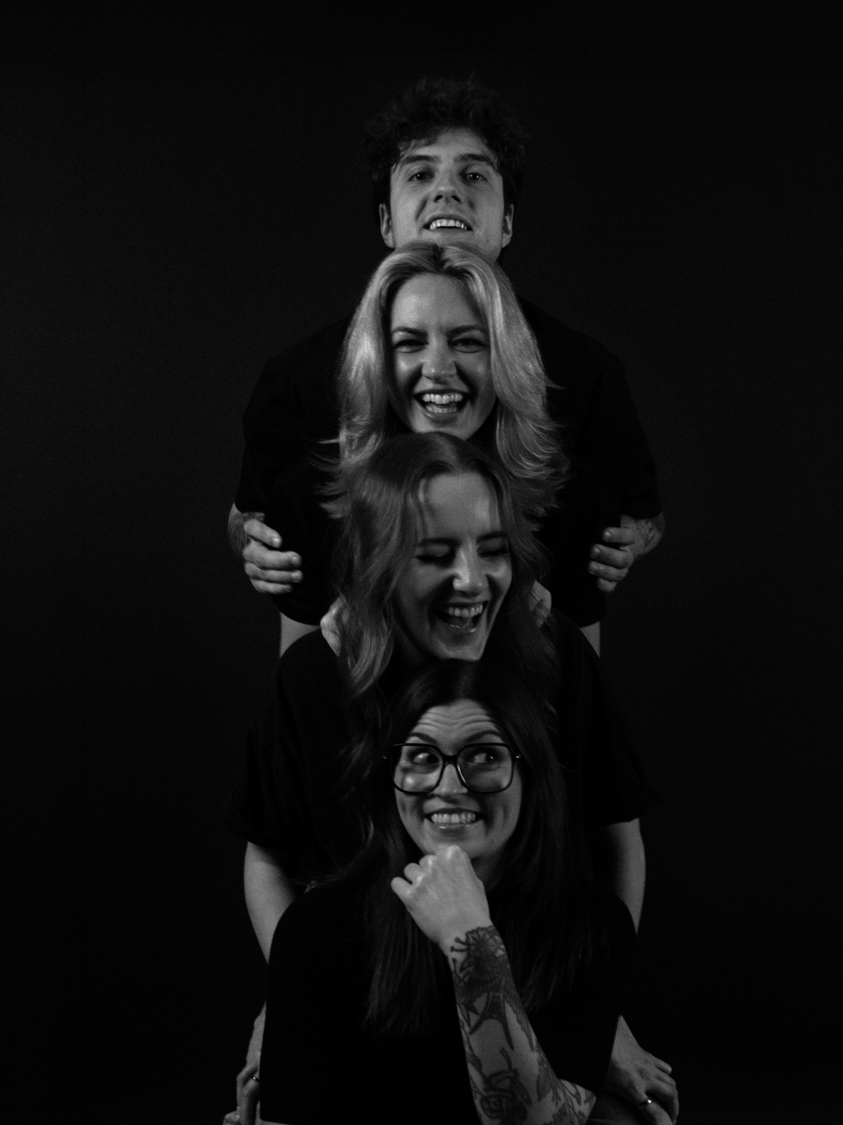 People celebrating, red stickers floating in the air