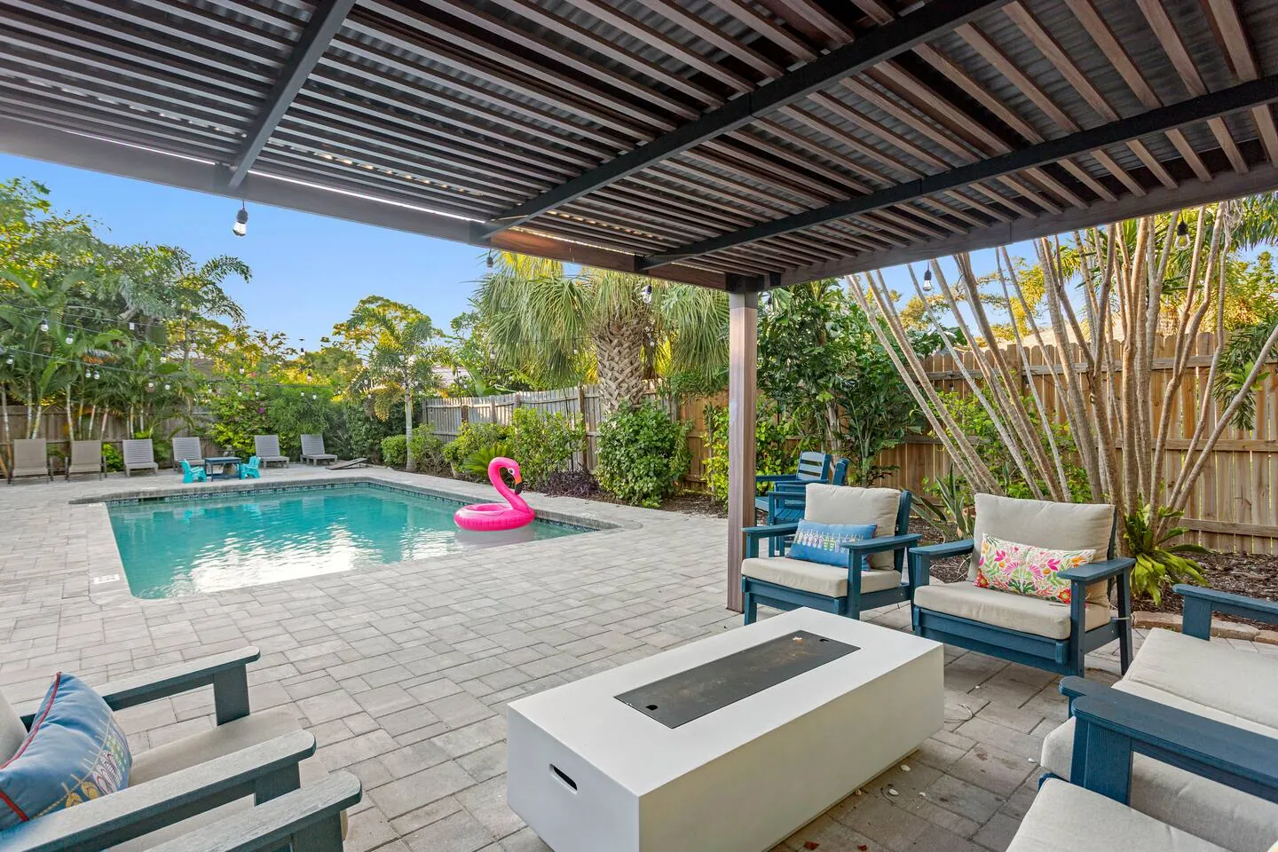 Pergola view toward pool by day at Sarasota Beach Bungalow, Bradenton, Florida
