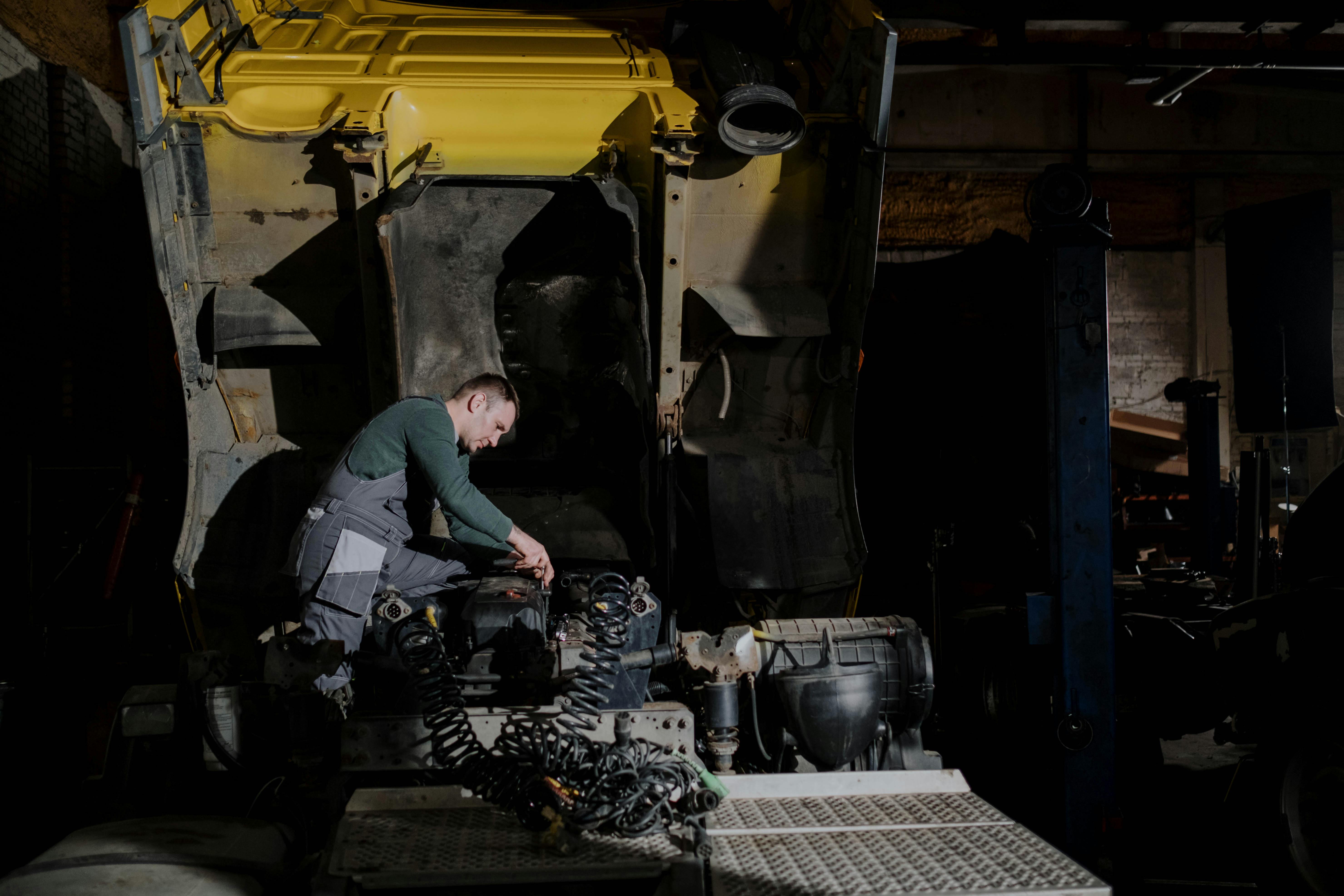 Mechanic working on a broken down truck