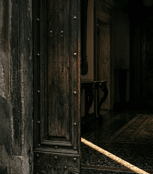aged wooden door with light entering interior, Rome architectural detail