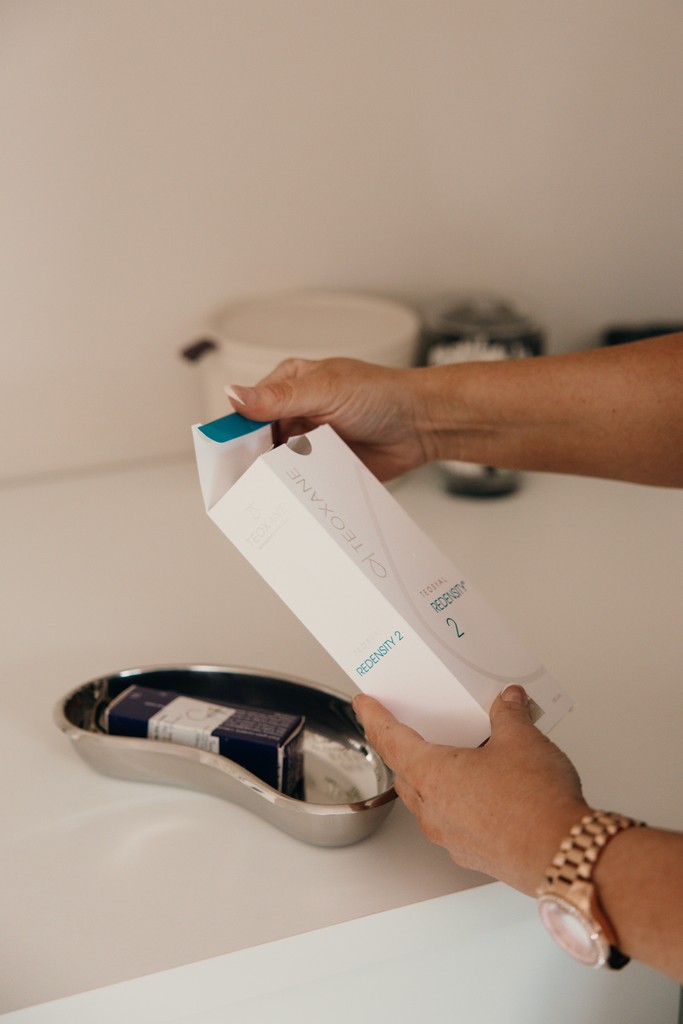 Two people stretching on yoga mats