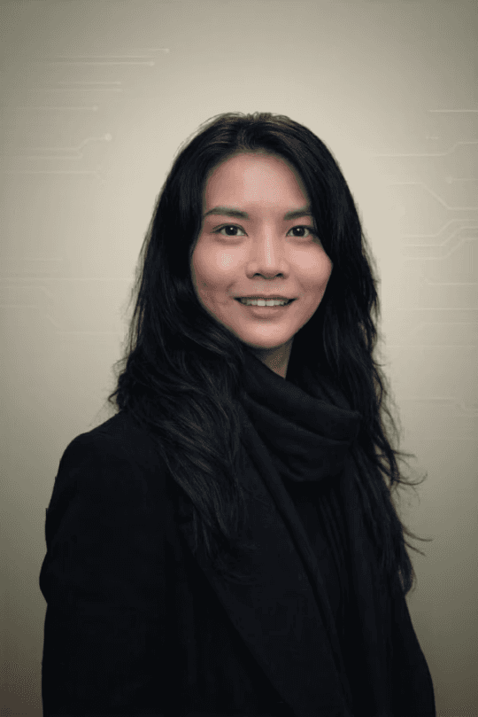 Professional headshot of a business advisor in a white shirt, smiling confidently against a warm neutral background.