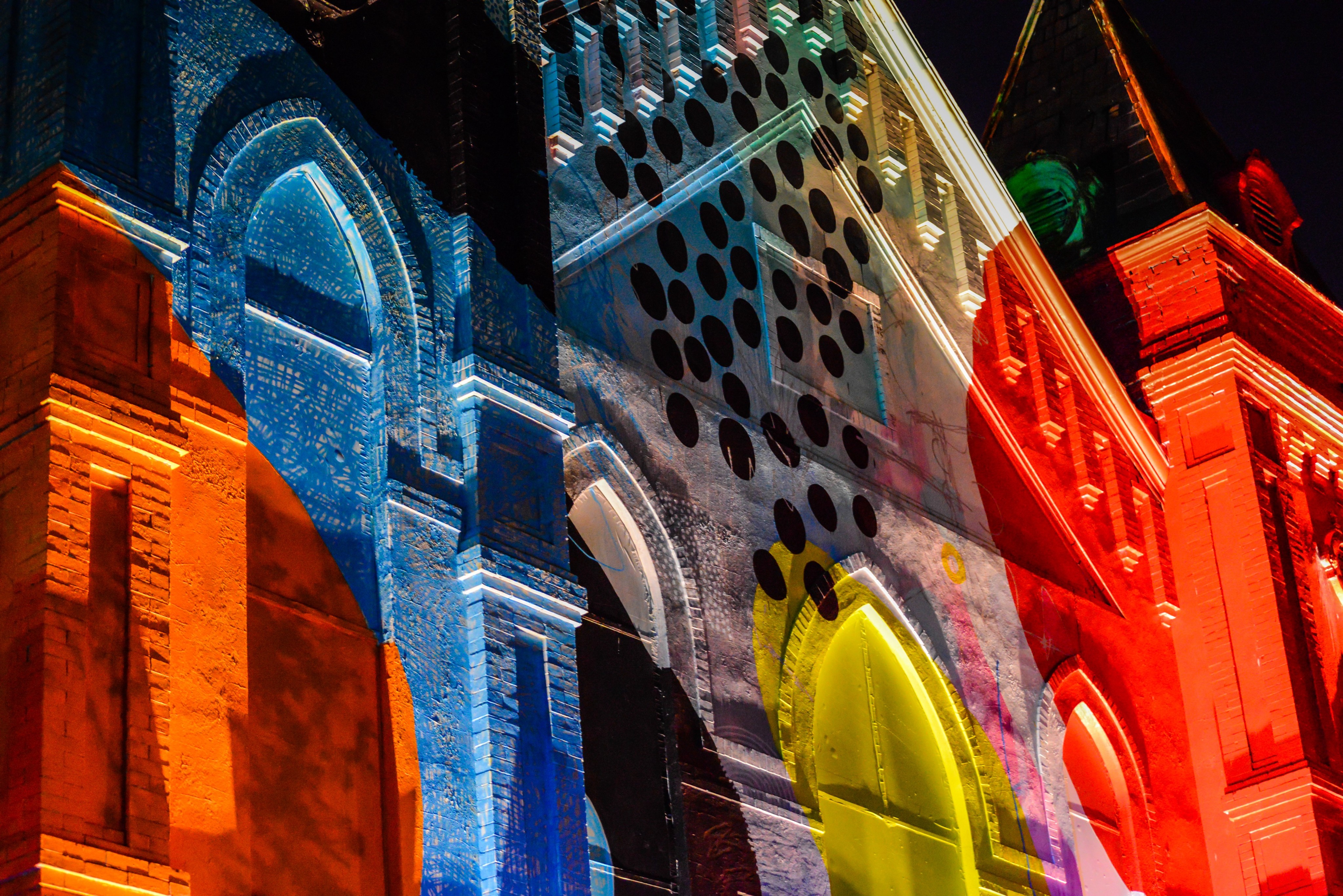 Colorful close-up of a painted church in SE Washington D.C. featuring various vibrant elements.