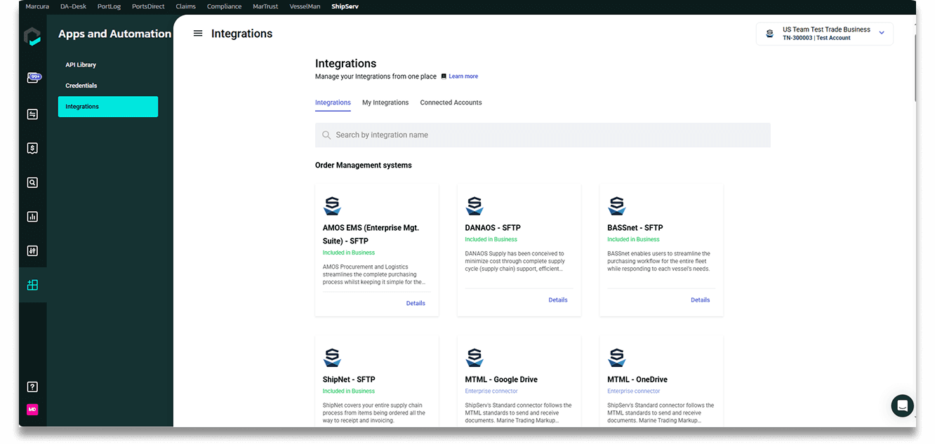 A crew member in an orange suit approaches a large cargo ship while others climb the side of the vessel.