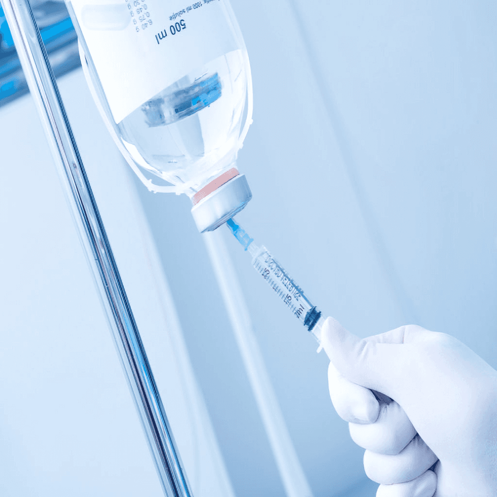 Close-up of an intravenous drip being prepared for Artery Chelation Therapy (ACT) treatment at Sibia Medical Centre. The image highlights the precision and care involved in administering ACT for heart disease and detoxification.