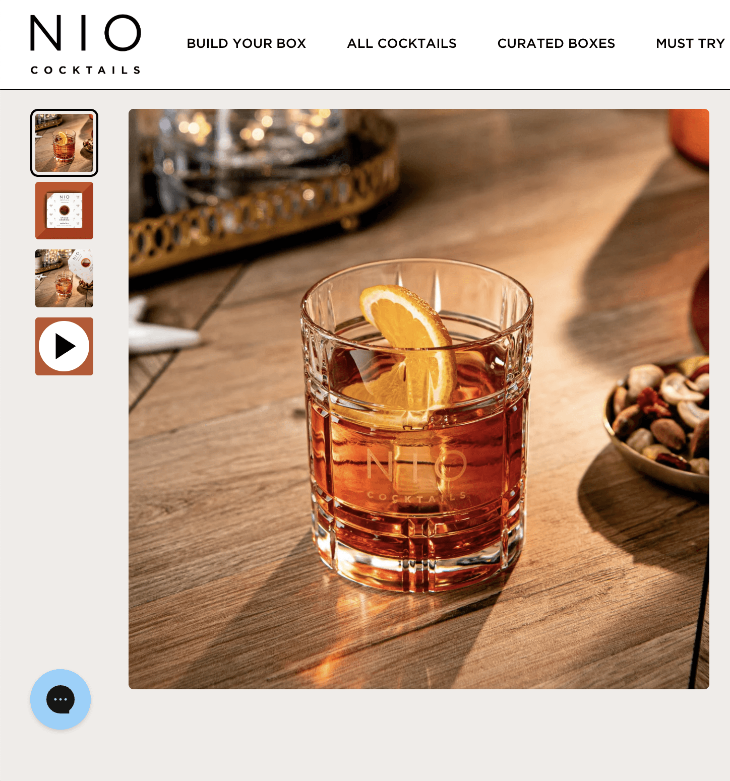NIO Cocktails product page showing a cocktail with orange slice and nuts