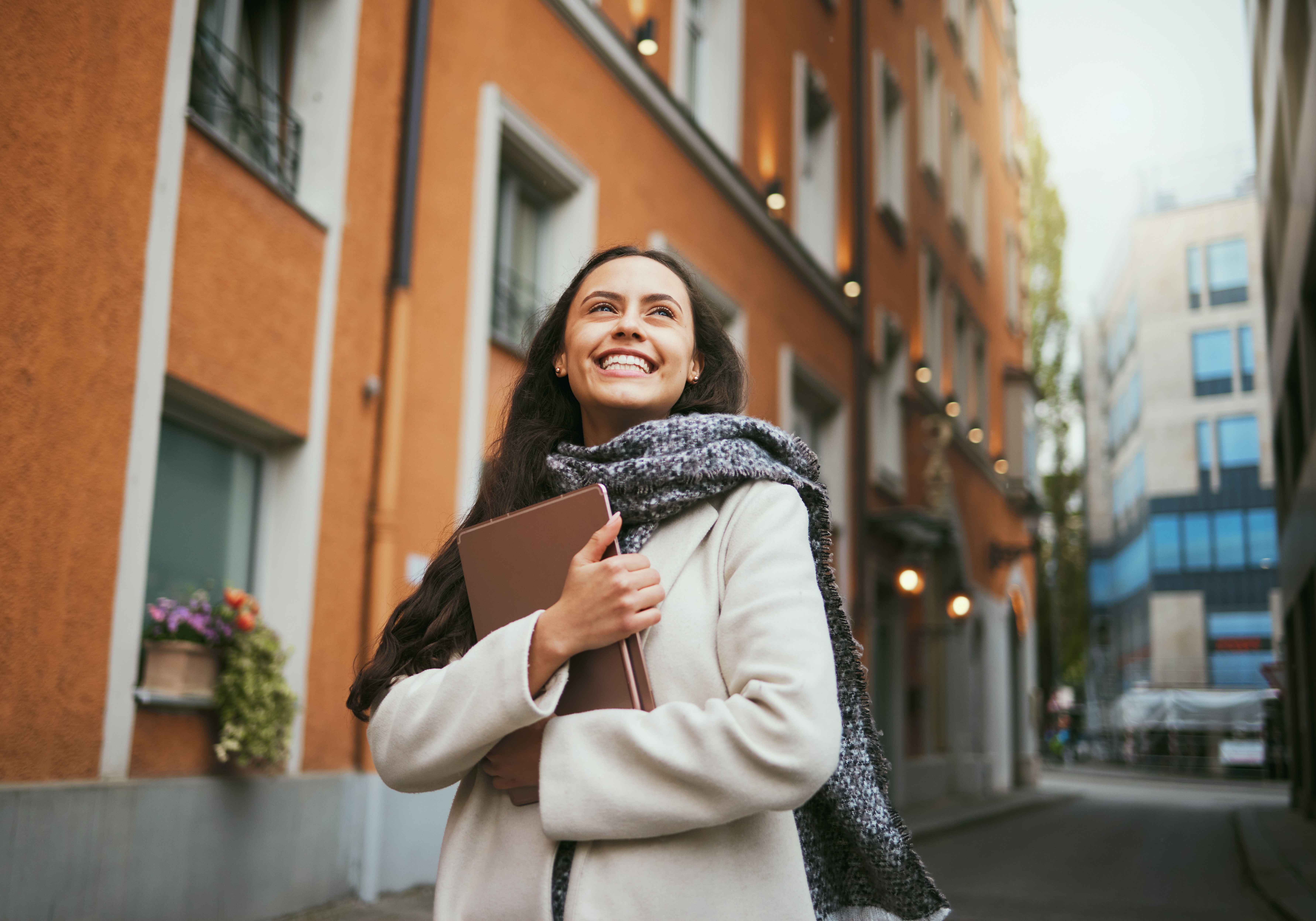 A maroon passport, a credit card, and a document are placed on a dark surface.