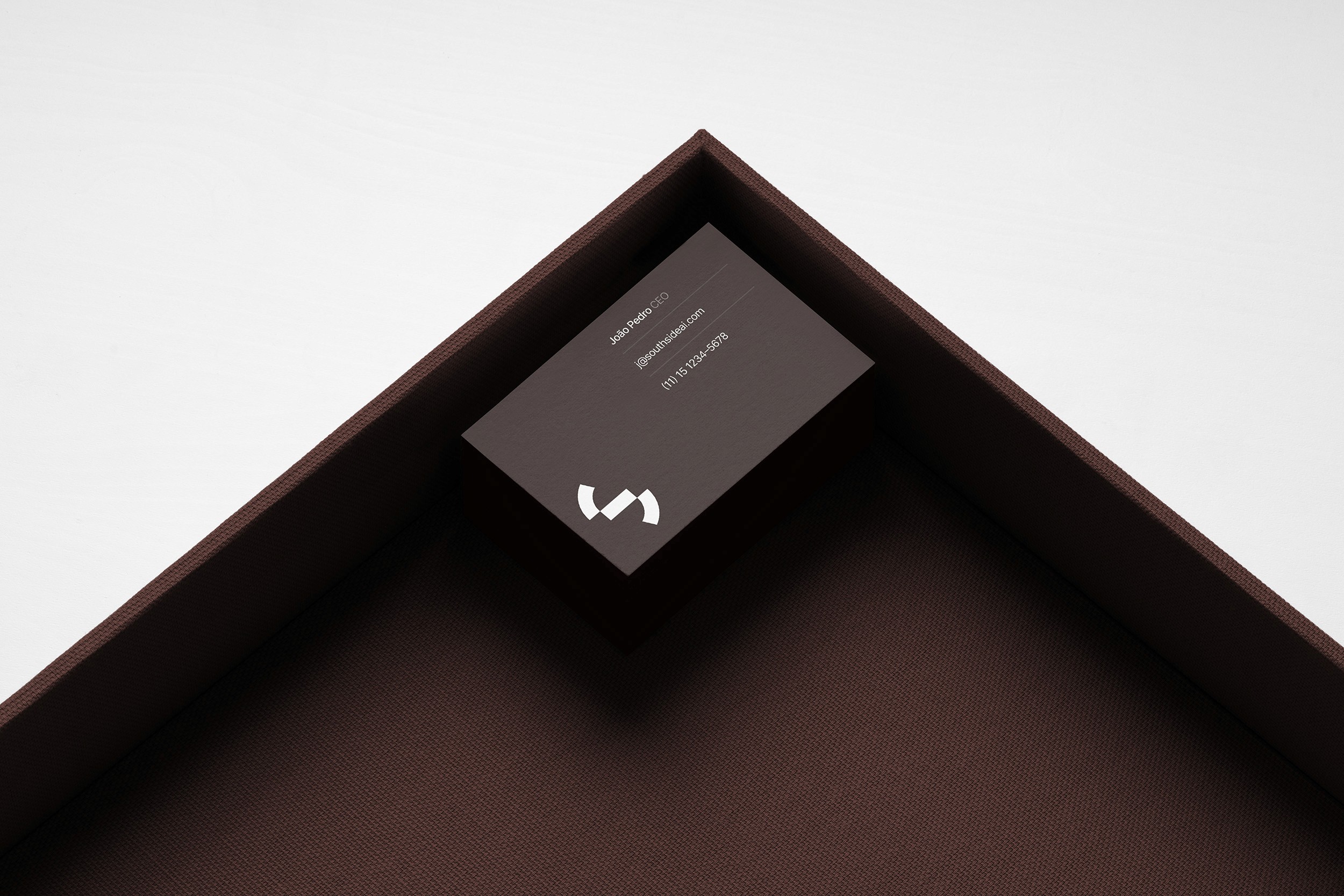 Business card laying in a high-end setting with a lot of negative spacing