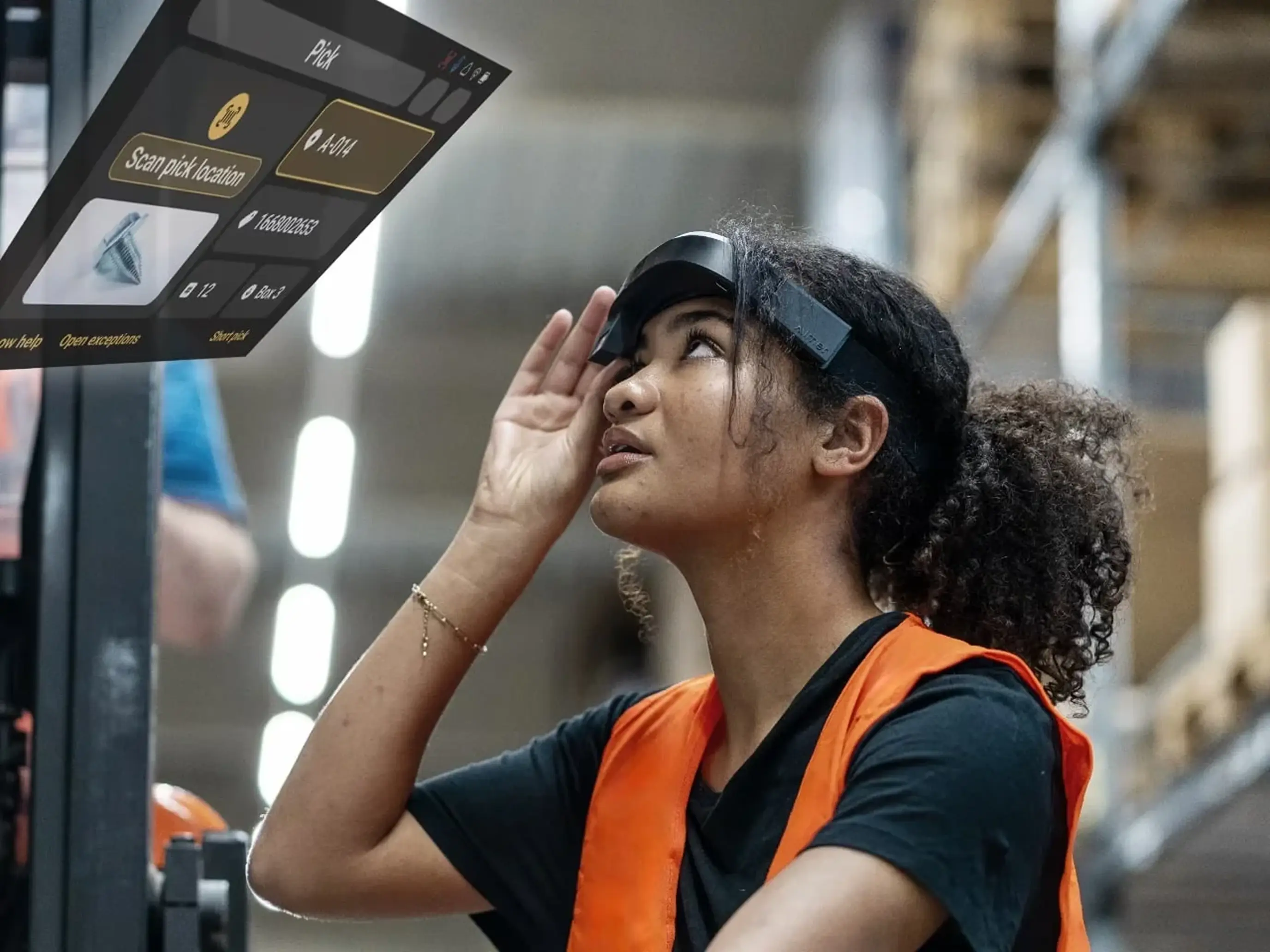 Female warehouse worker wearing a TeamViewer Frontline smart glasses headset in a logistics facility, looking up at an AR heads-up display showing a warehouse pick list with barcode scanning instructions