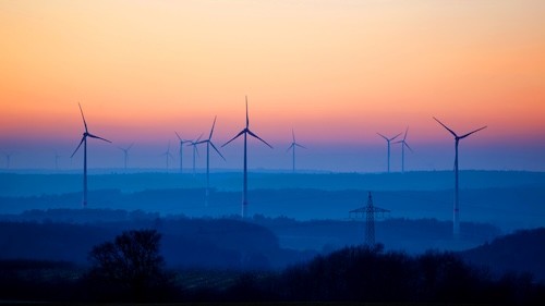 a group of children sitting on steps in front of a building