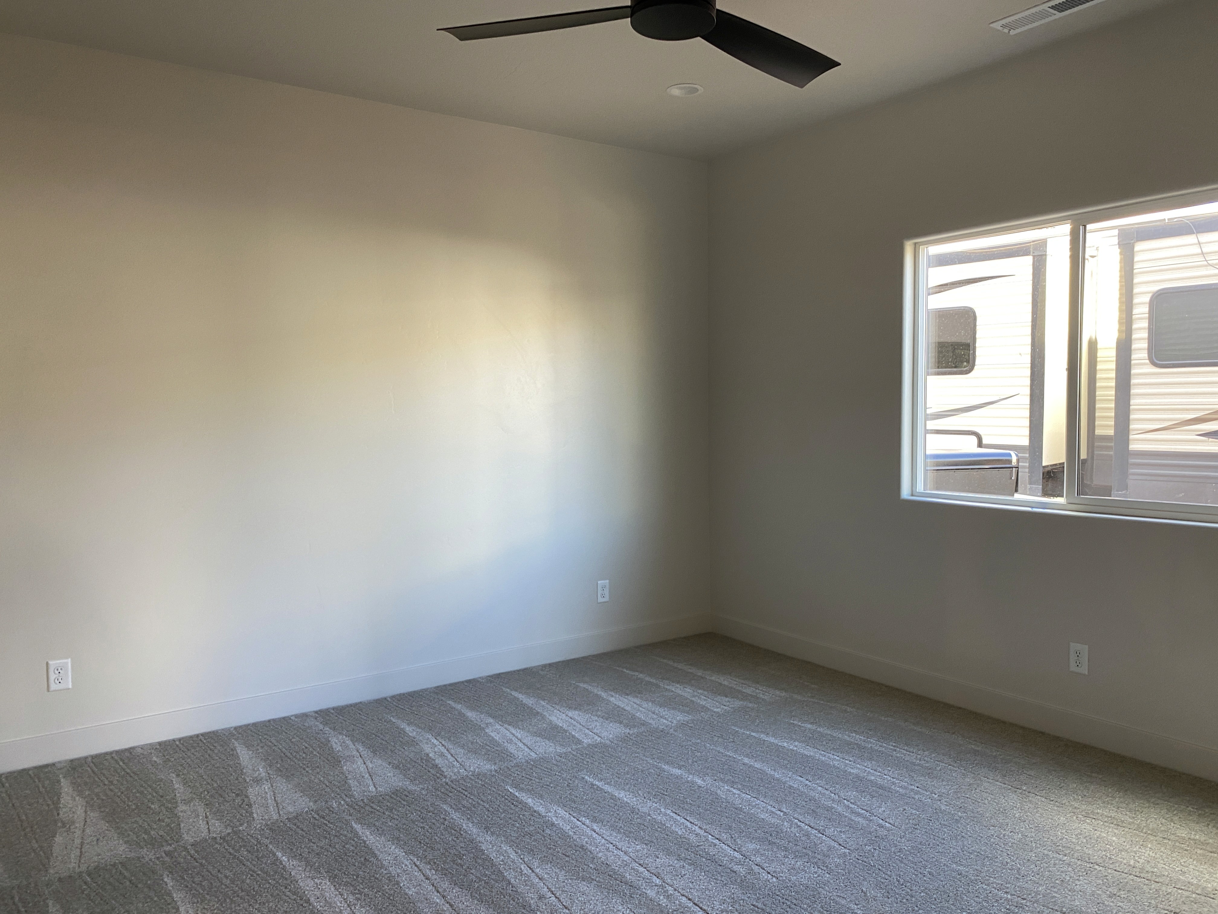 Primary bedroom in a duplex home with clean design and comfortable space in a Hurricane, Utah home.