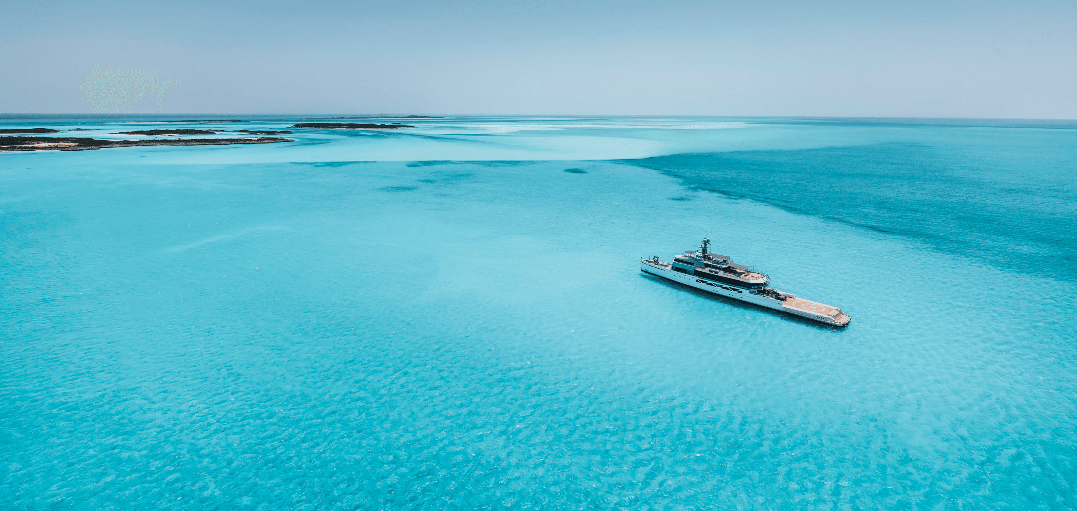 Cozy orange velvet lounge chair by glowing lamp.