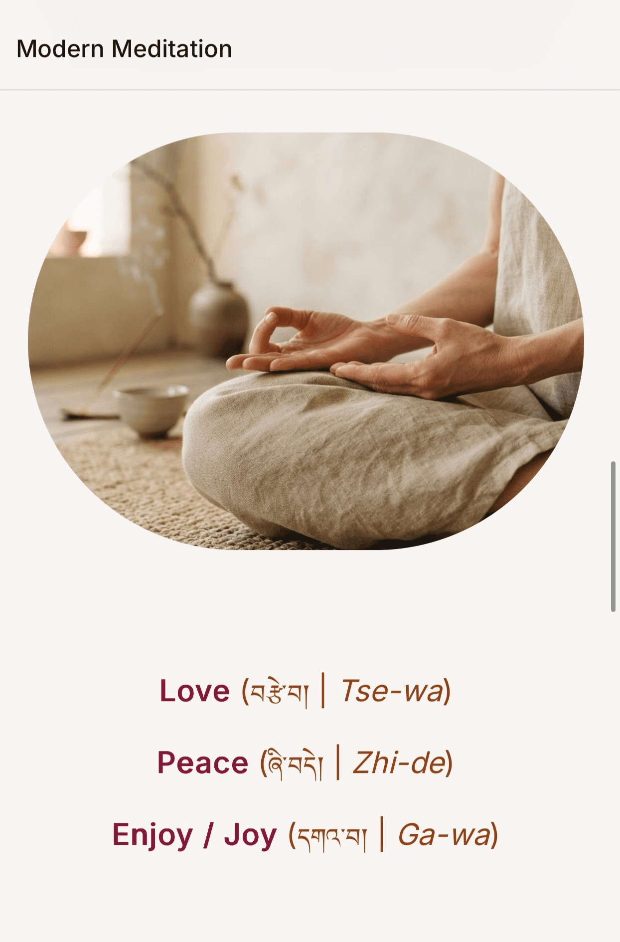 Modern Meditation screen showing a person meditating with words for love, peace, and joy.