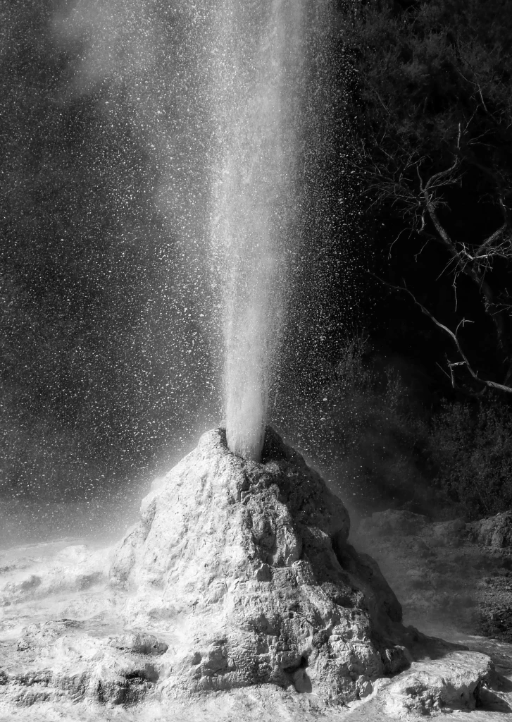 Rotorua geothermal geyser eruption in New Zealand, a natural attraction for travellers arriving by private jet charter