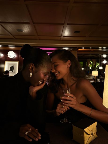 Two friends sharing a moment over a drink