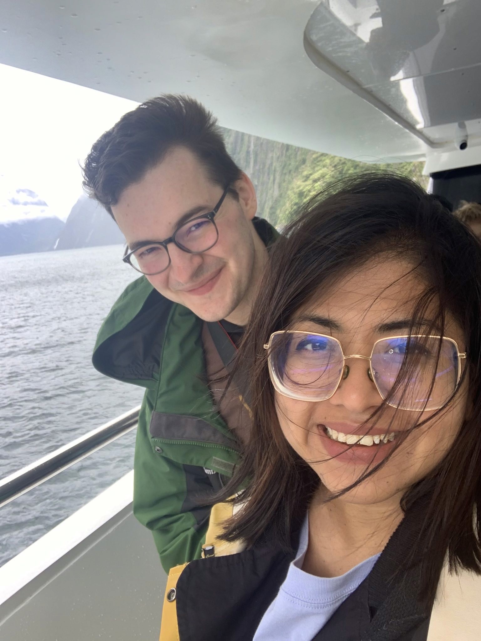 Two gold wedding rings rest atop a soft, textured fabric with a subtle pattern. The rings shine under gentle light, evoking themes of love and commitment.