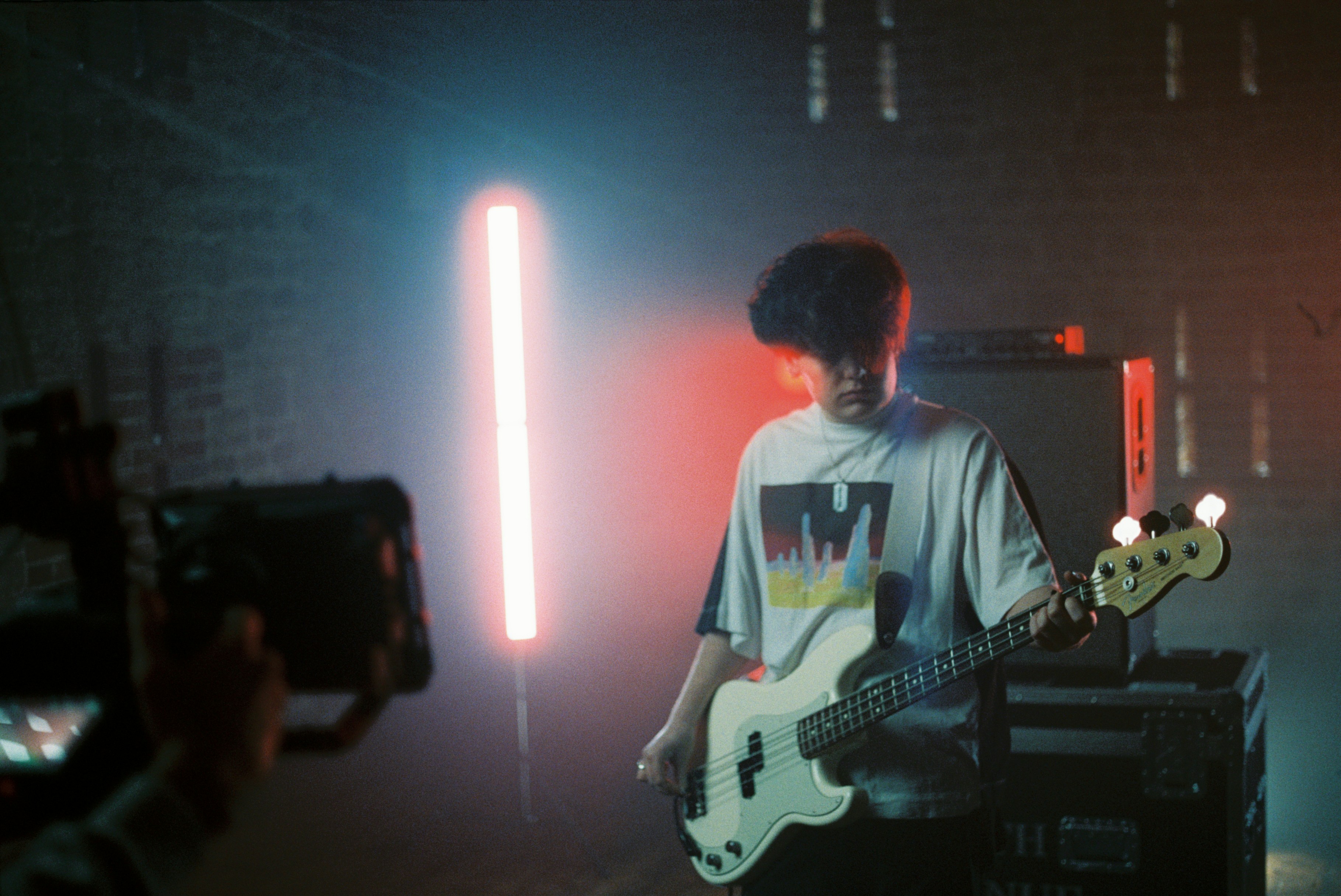 teen guy playing guitar