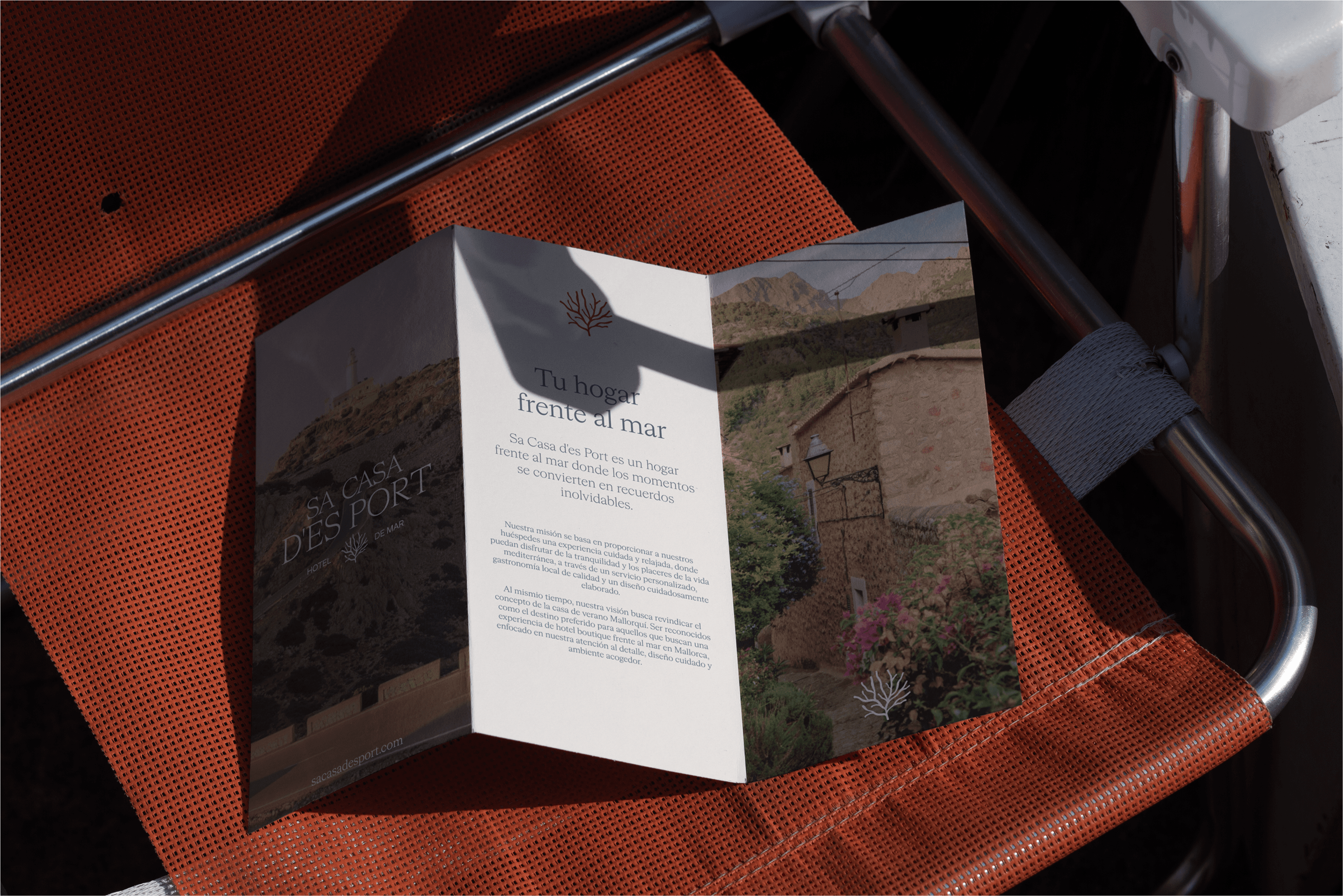 Chair with champagne and glasses by window.