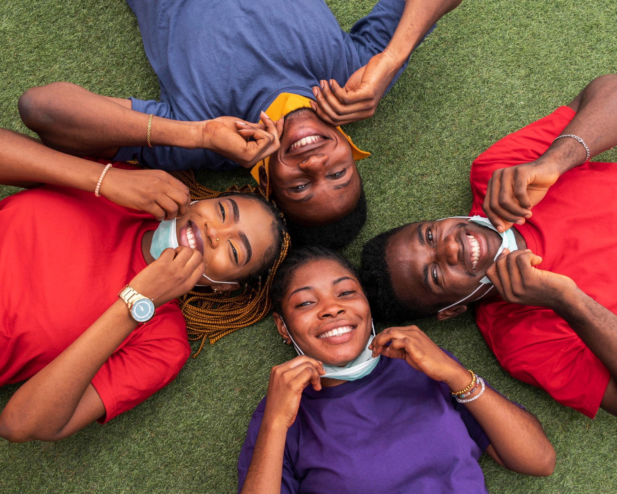 a group of children sitting on steps in front of a building